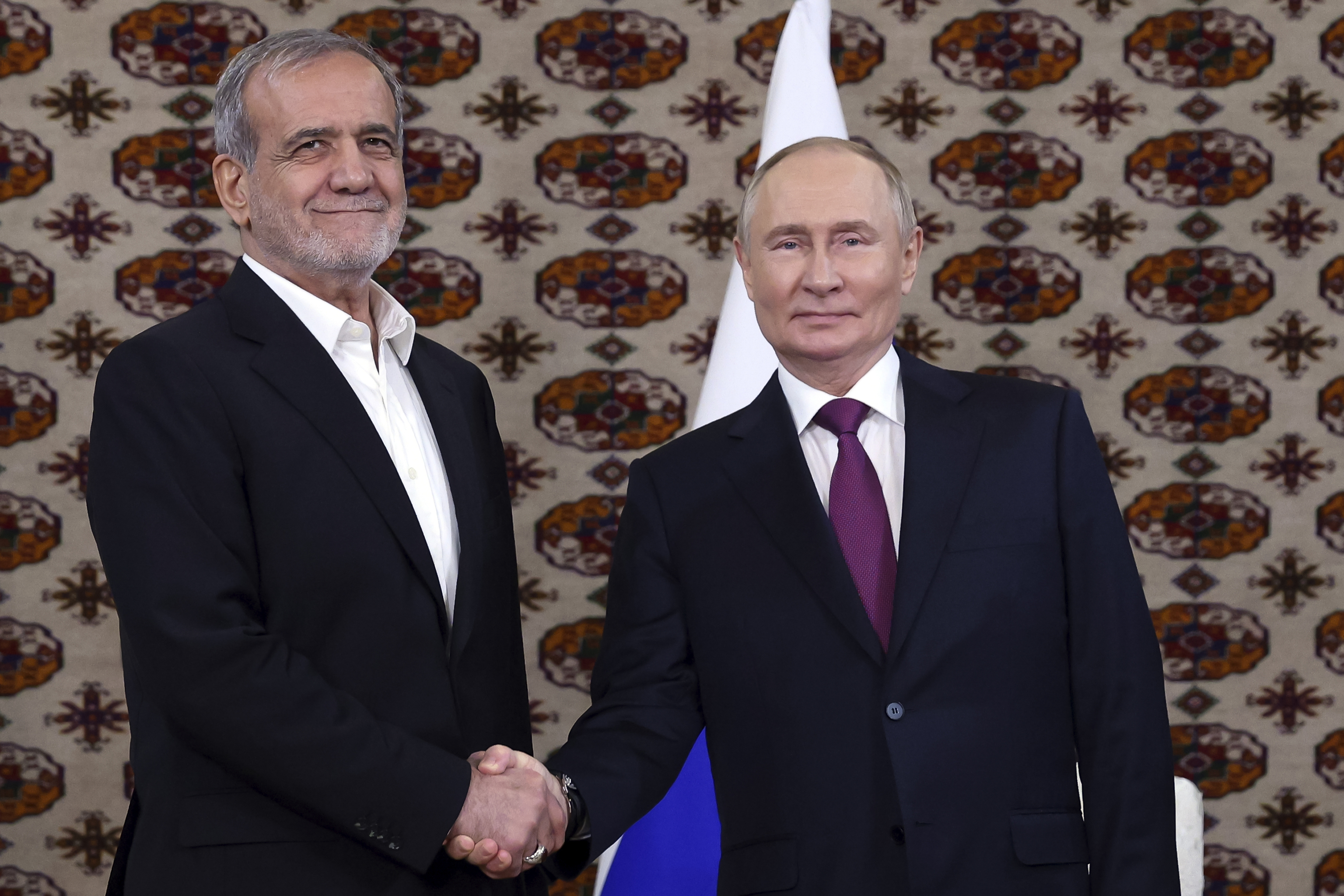 Russian President Vladimir Putin, right, and Iranian President Masoud Pezeshkian.