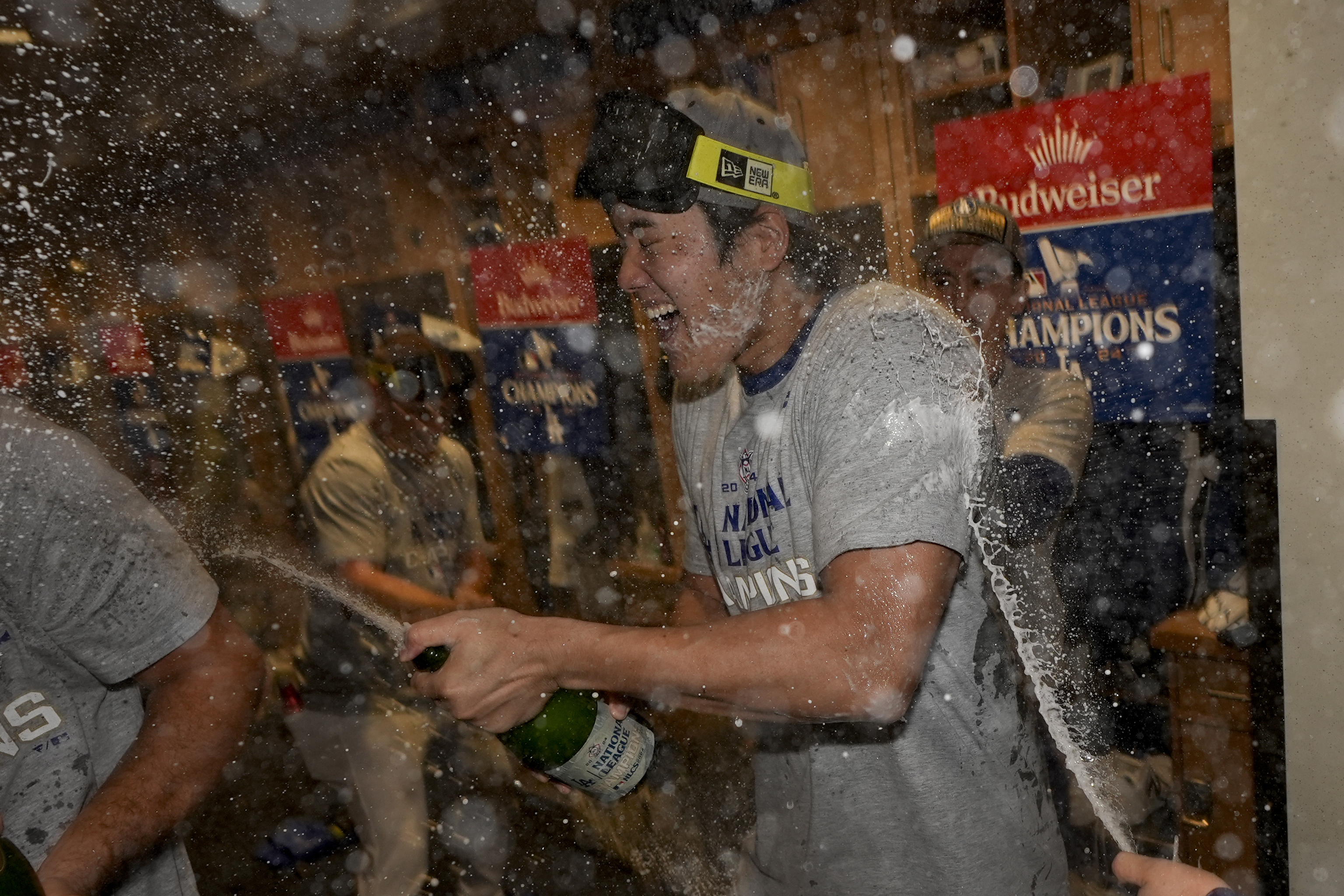 Los Angeles Dodgers Shohei Ohtani celebrates in the locker room after their win against the New York Mets in Game 6.