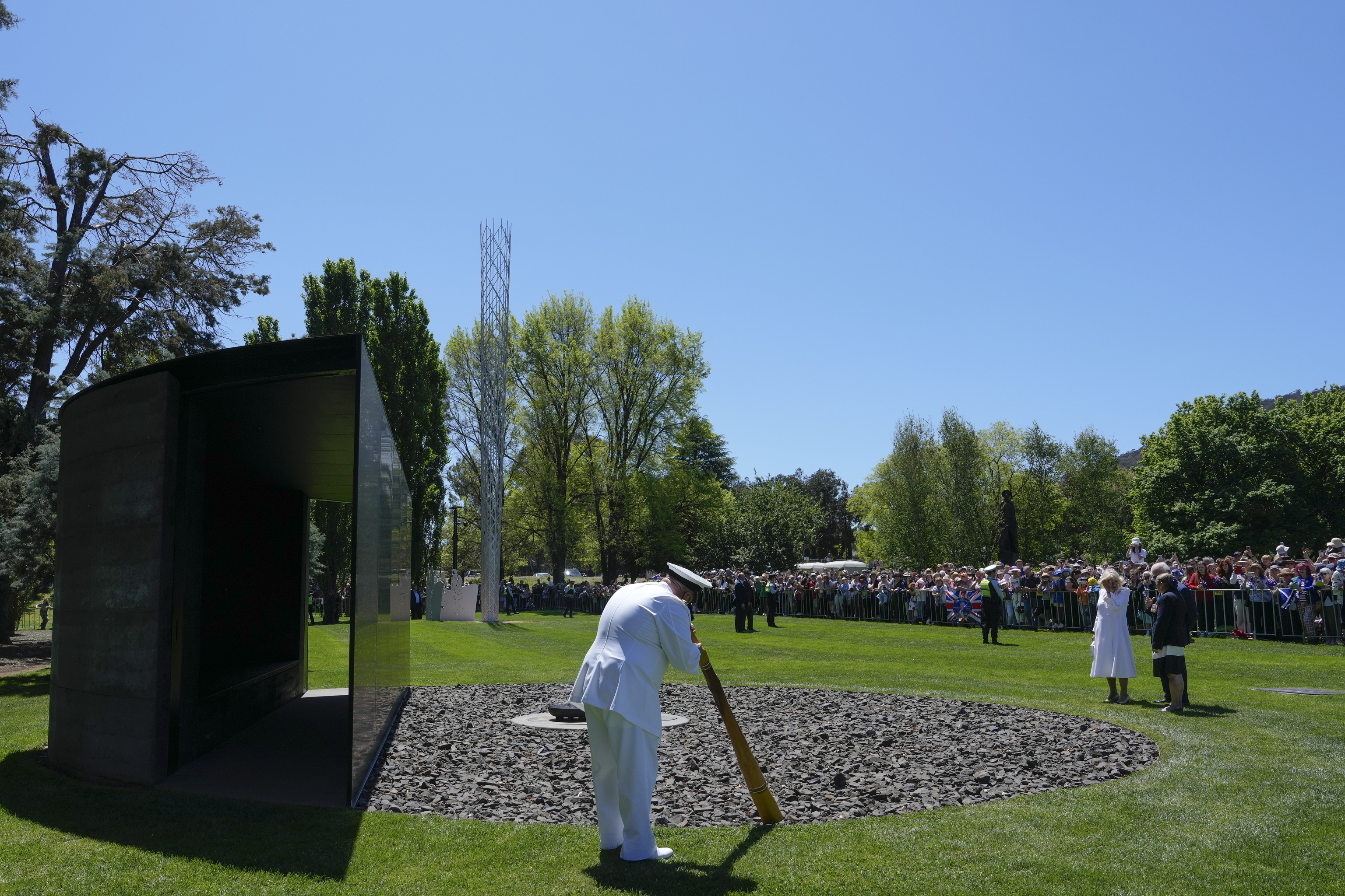 Britain's King Charles III, center from right, and Queen Camilla, third from right, visit the For our Country at the Australian War Memorial in Canberra