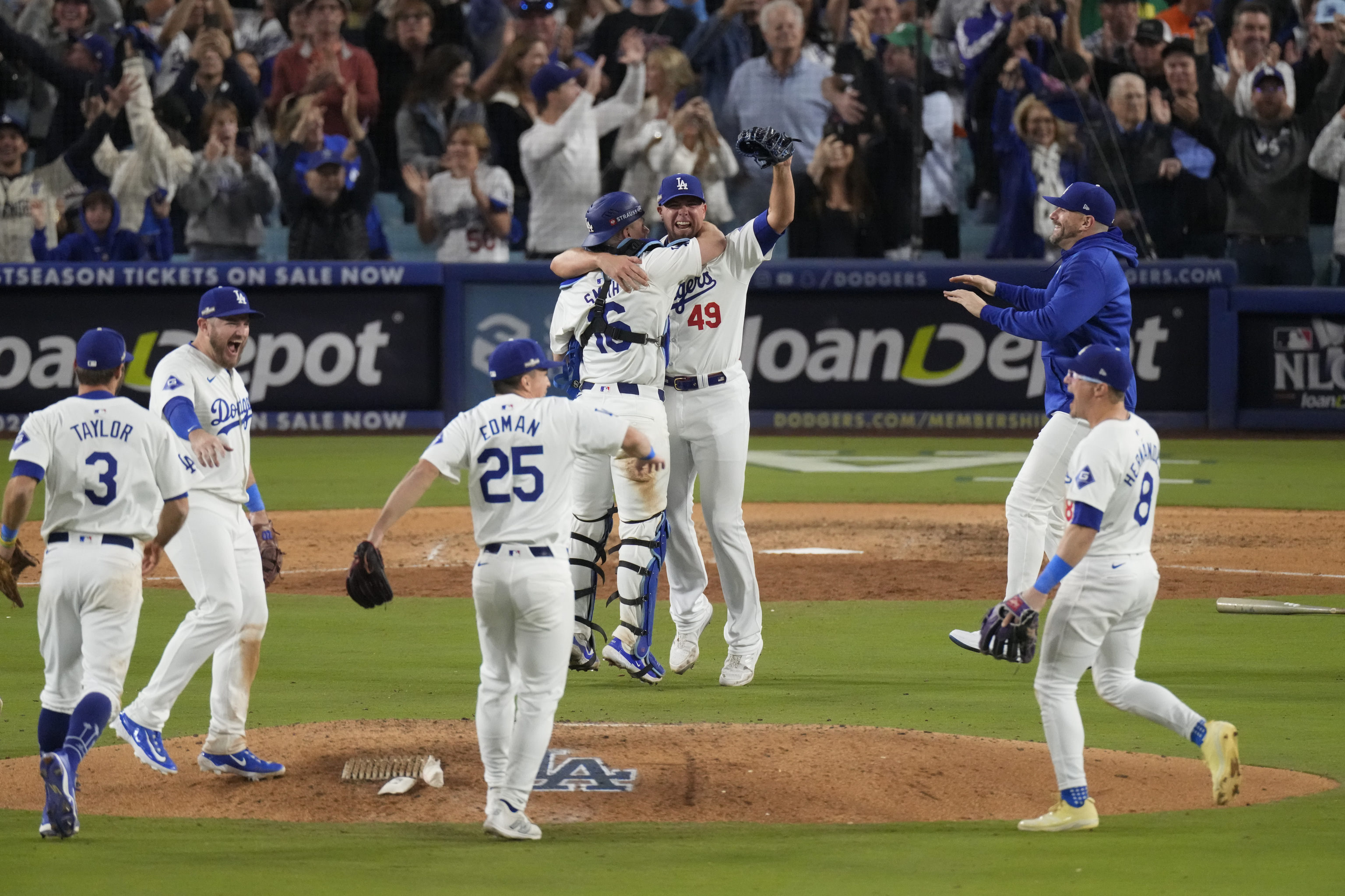 Los Angeles Dodgers pitcher Blake Treinen and catcher Will Smith celebrate their win against the New York Mets