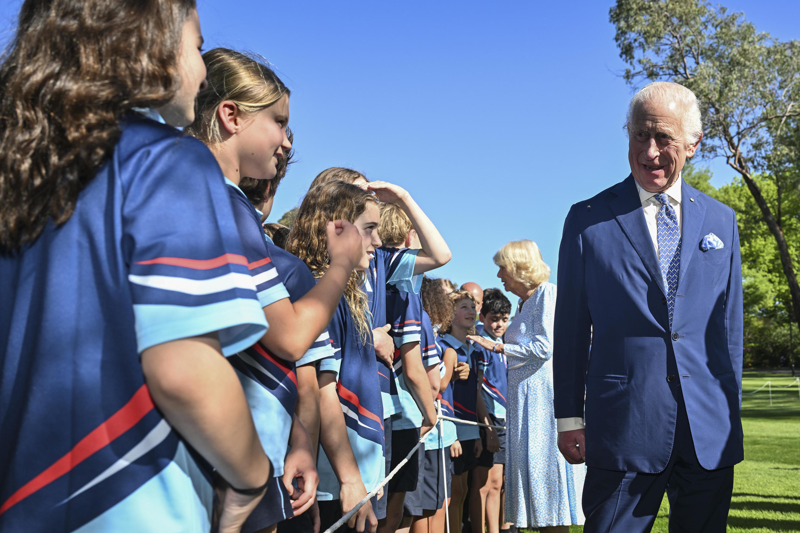 Britain's King Charles III speaks to schoolchildren in Canberra.