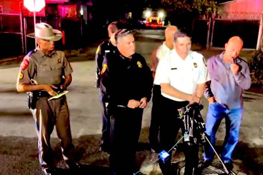 Mayor John Whitmire with police and firefighters after the accident, in a video capture.