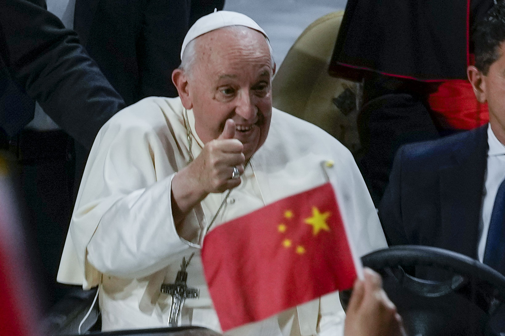 Pope Francis cheers at the participants as he arrives to preside over a mass at the Steppe Arena in the Mongolian capital Ulaanbaatar