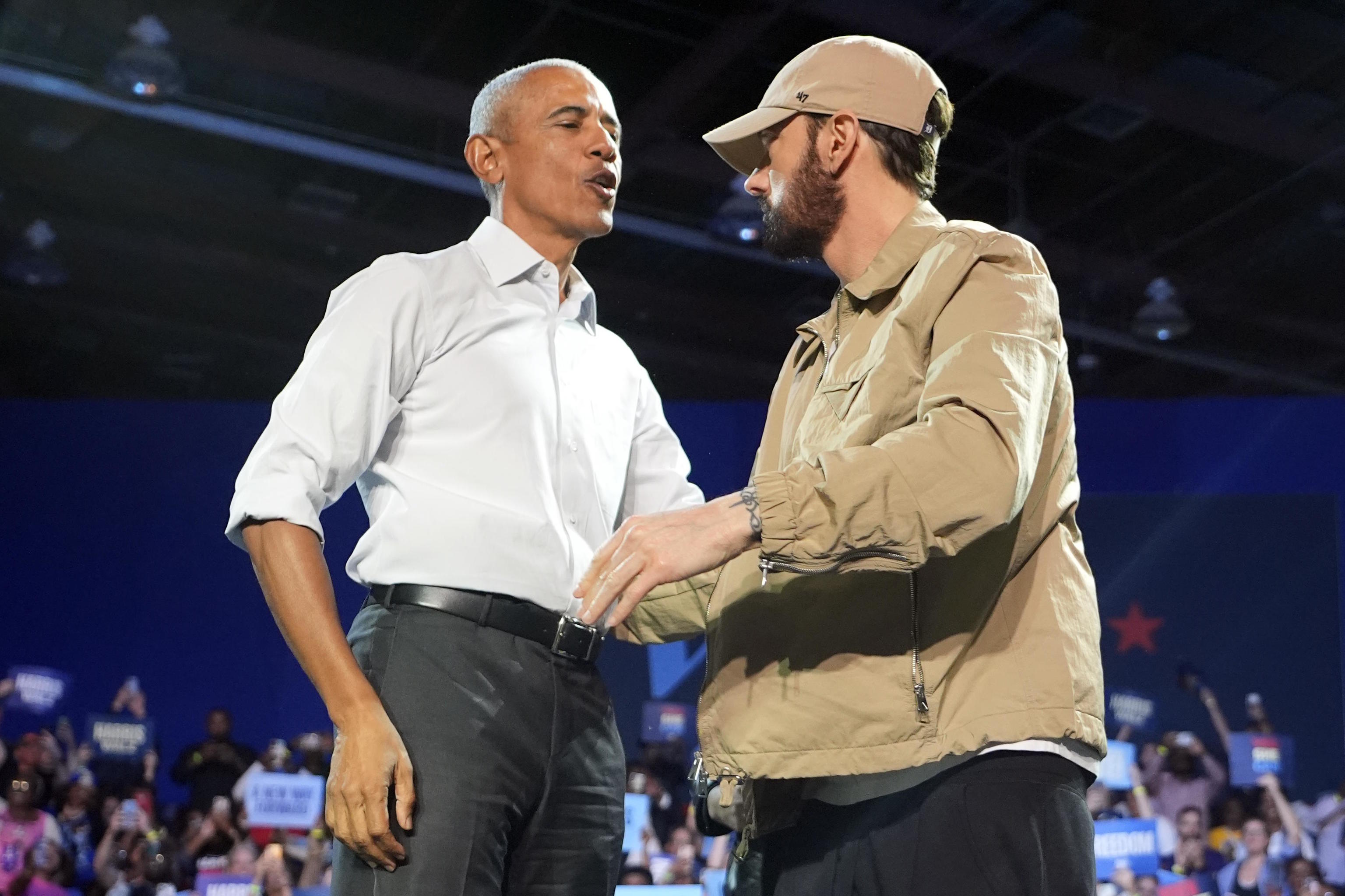 Rapper Eminem greets former President Barack Obama in Detroit.