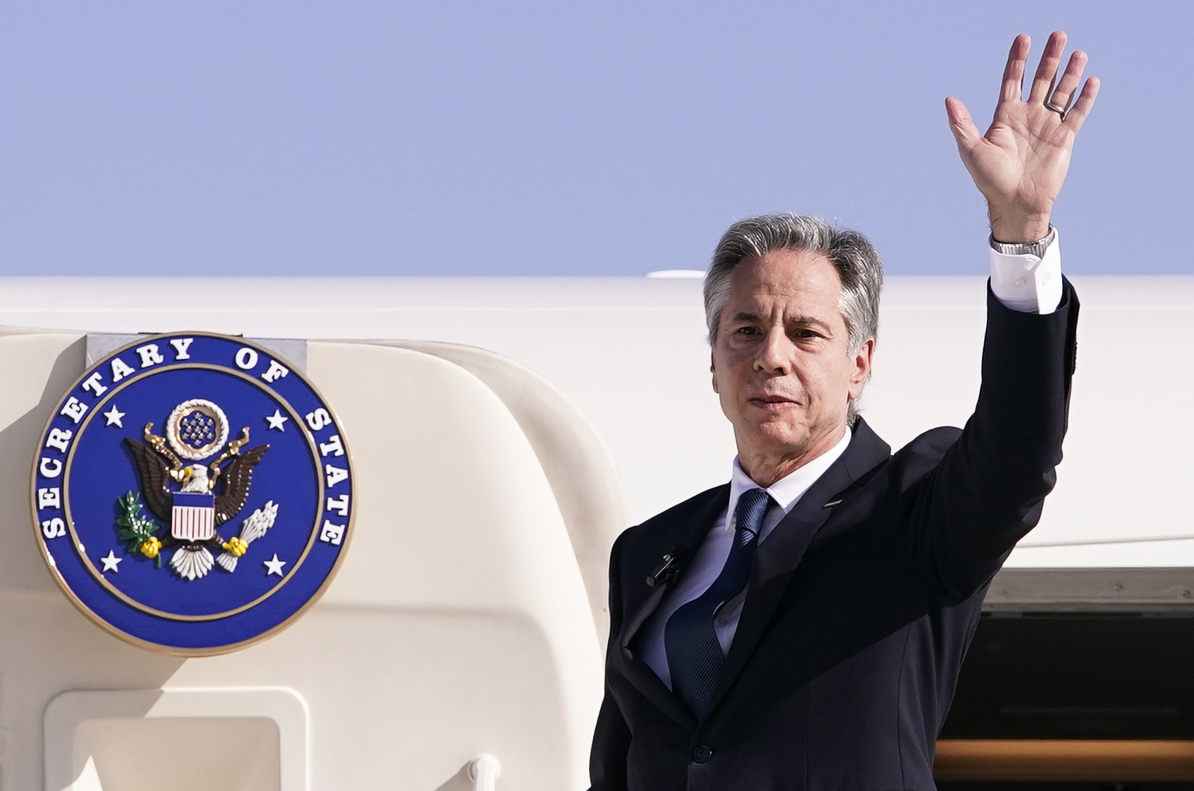 U.S. Secretary of State Antony Blinken waves as he departs for Riyadh, Saudi Arabia,