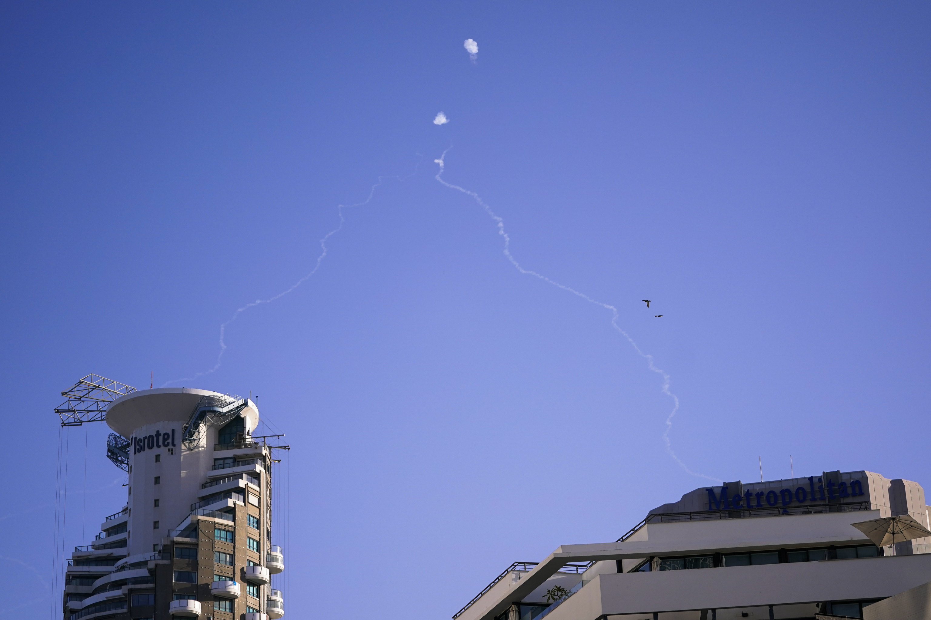 Israel's Iron Dome anti-missile system fires to intercept as air raid sirens sound in Tel Aviv