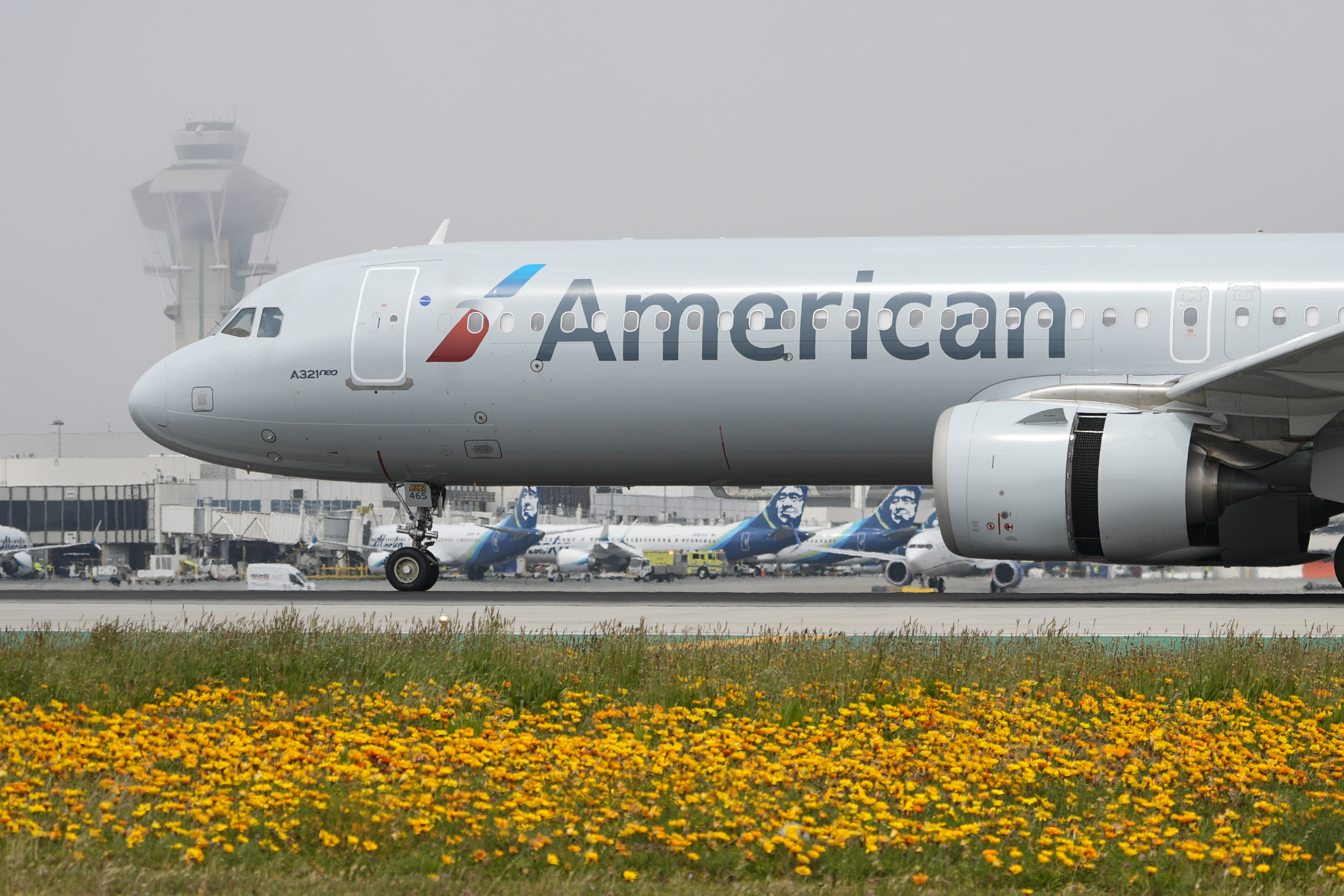 An American Airlines jet taxis at the Los Angeles International Airport