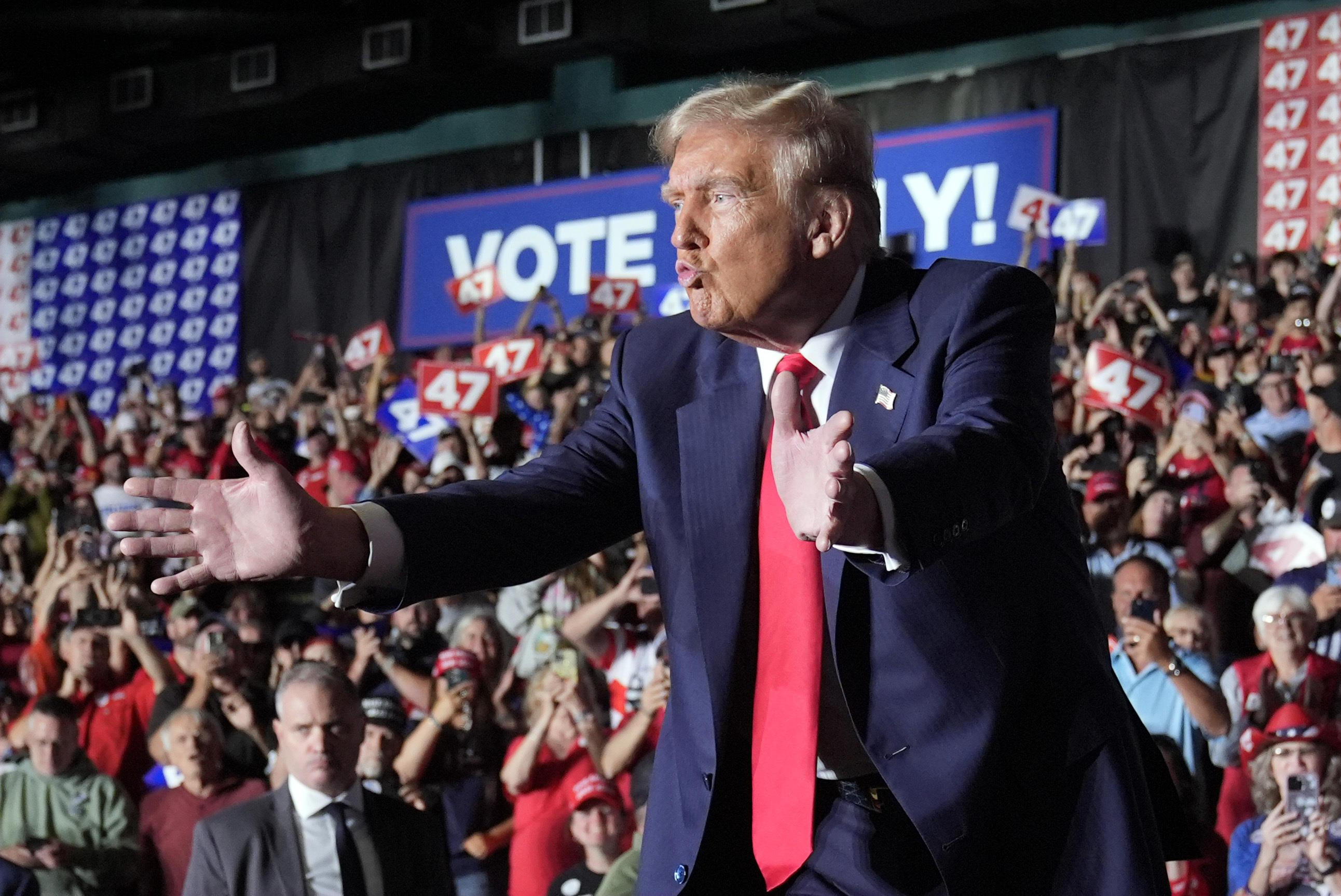 Trump gestures at a campaign rally at Greensboro Coliseum.