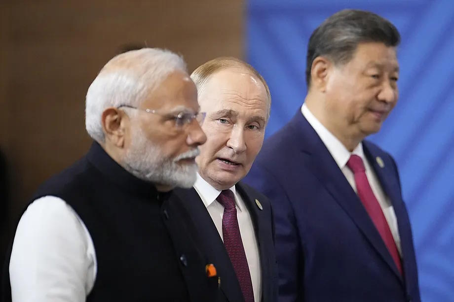 Narendra Modi, Vladimir Putin and Xi Jinping, from left to right.