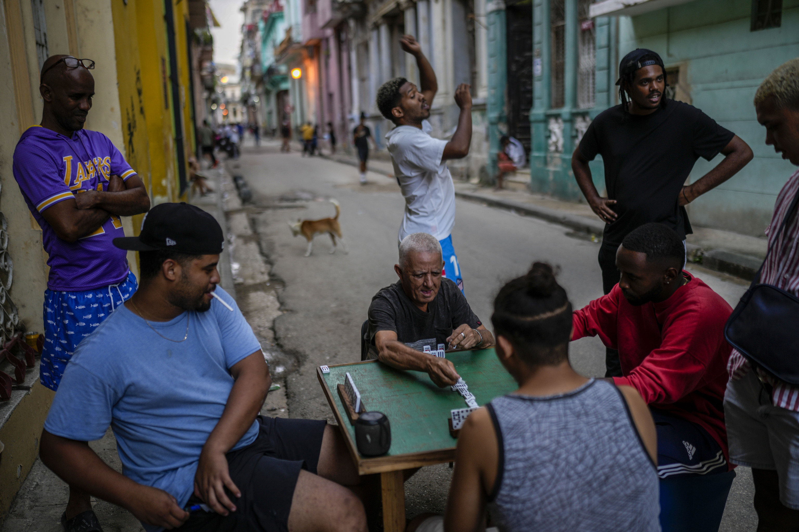 People play dominoes in the street during a power outage in Havana