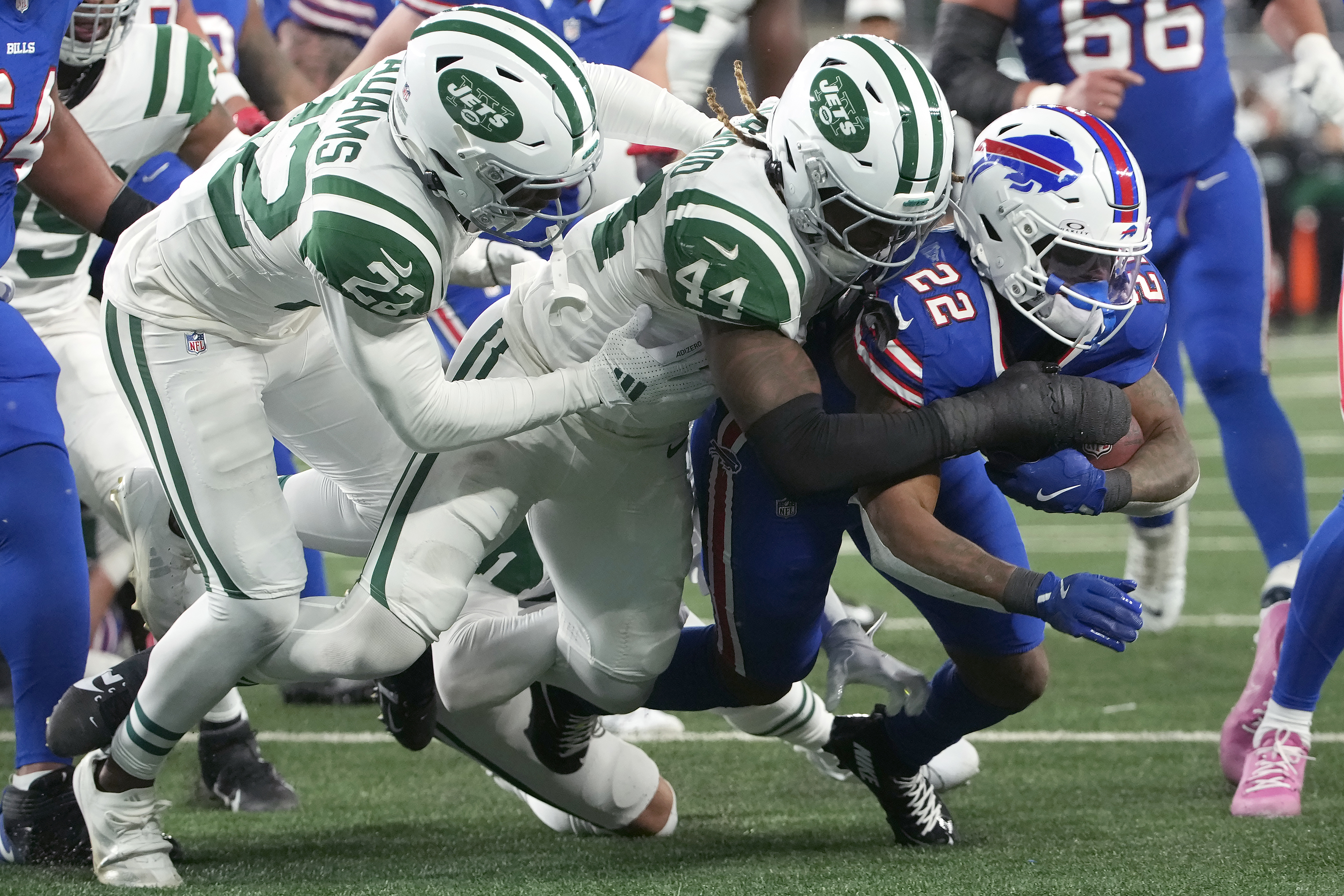 Buffalo Bills running back Ray Davis, right, runs against New York Jets safety Tony Adams.