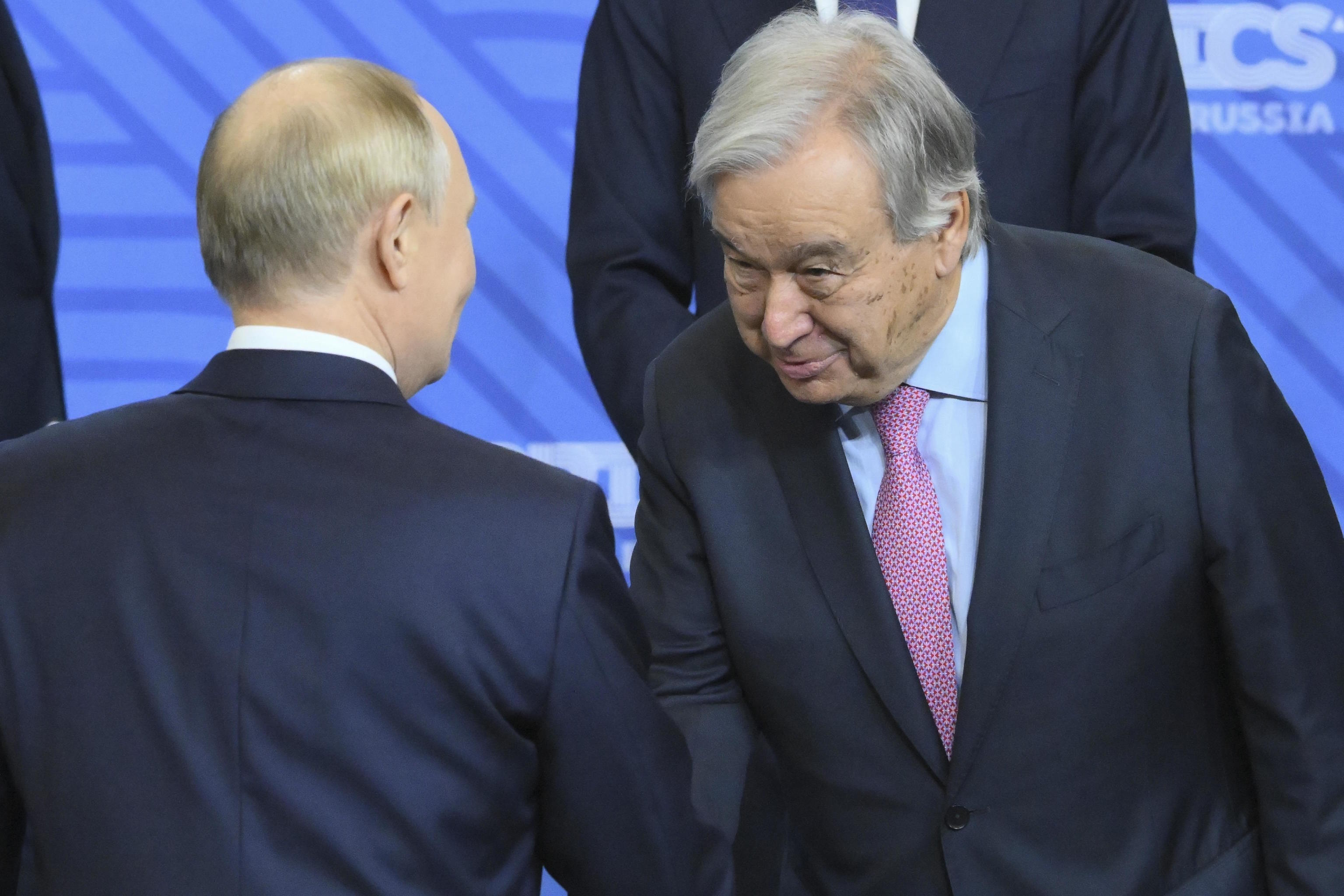 Guterres and Putin shake hands in Kazan, Russia, at the BRICS summit.