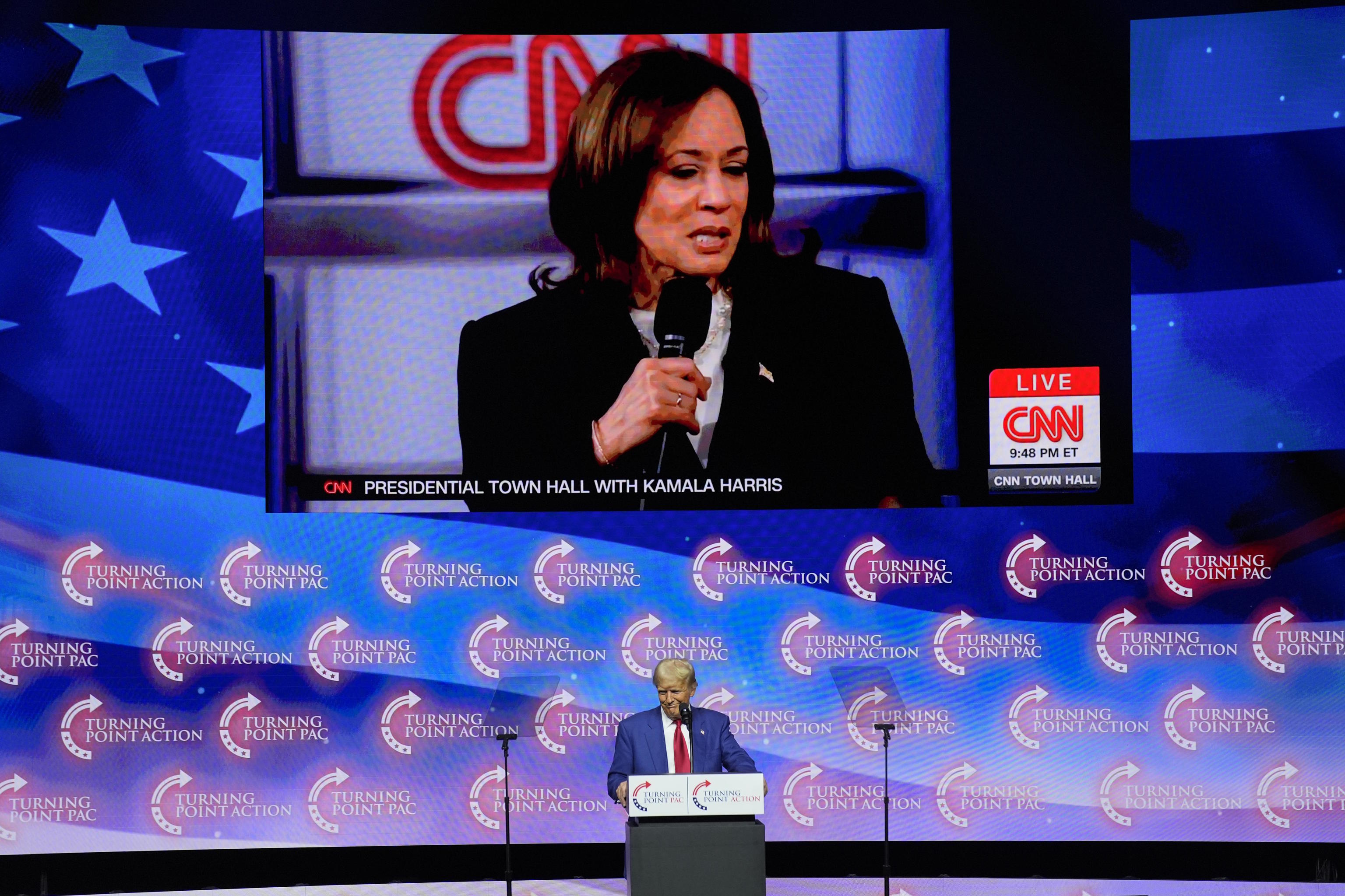 Trump shows videos of Kamala Harris during a campaign event in Georgia.