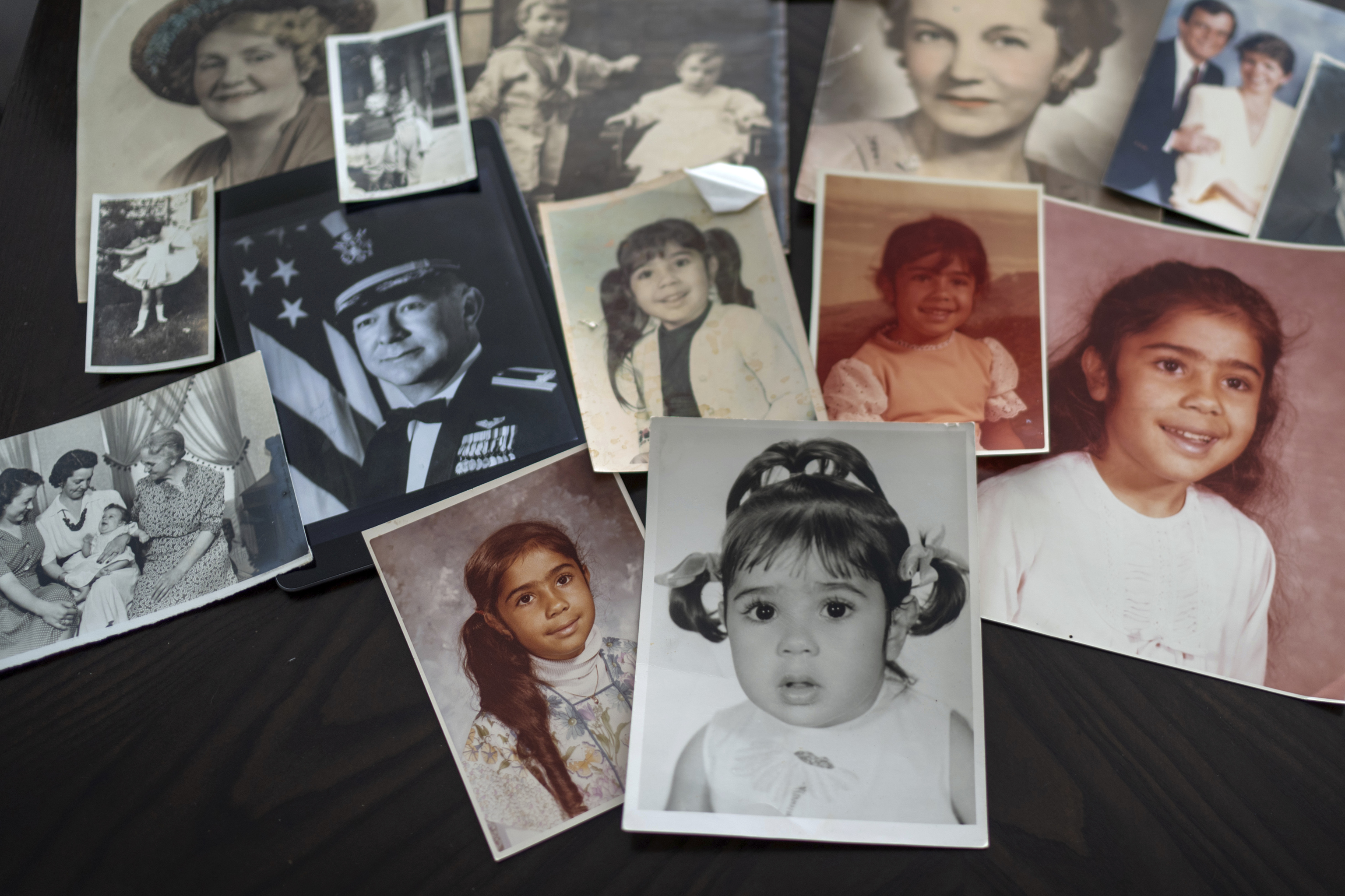 Childhood photos of Buttons are displayed along with a picture of her father, a WWII Air Force veteran, at left, and additional family photos