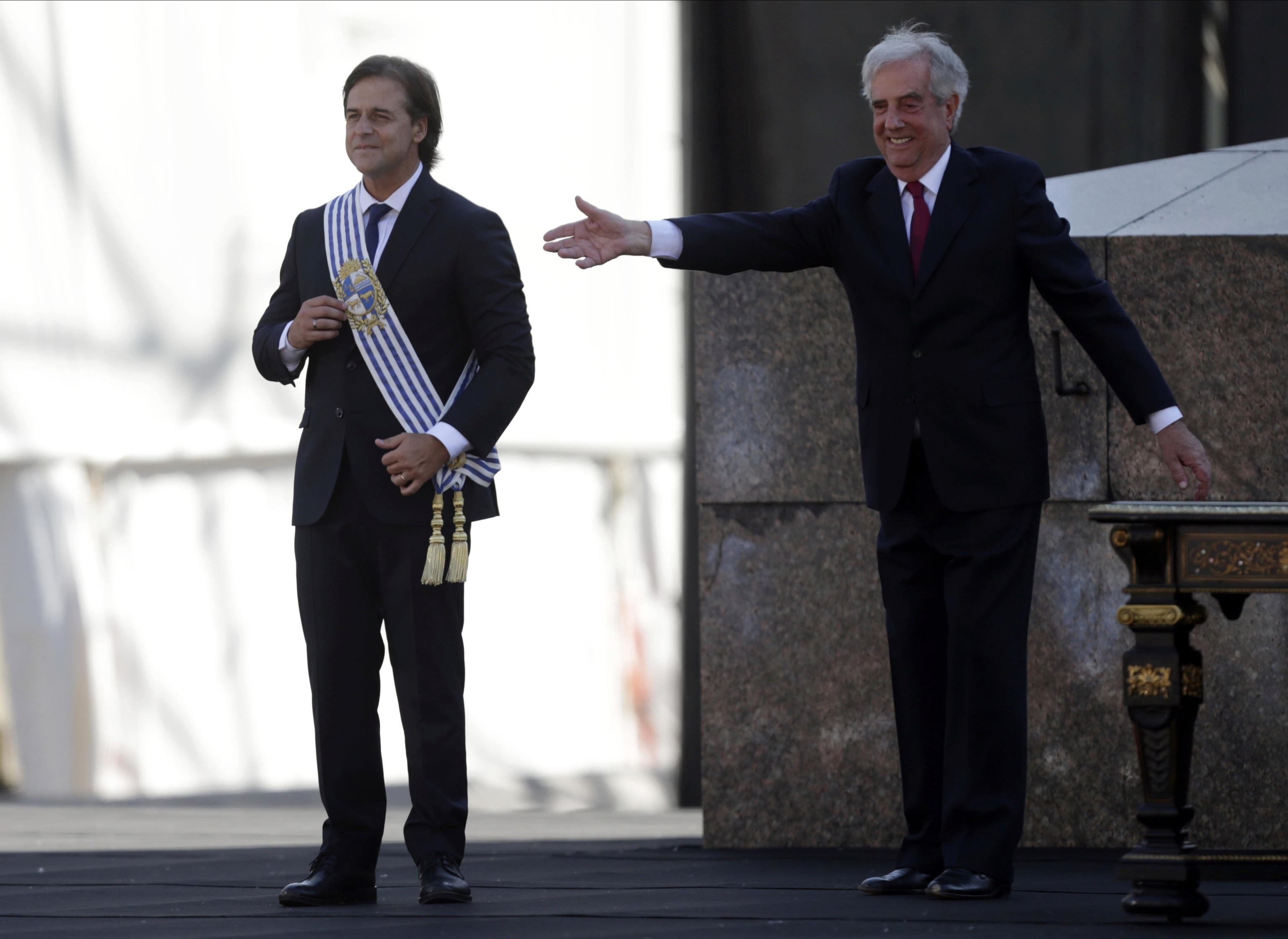 Uruguay's President Lacalle Pou smiles after receiving the presidential sash.