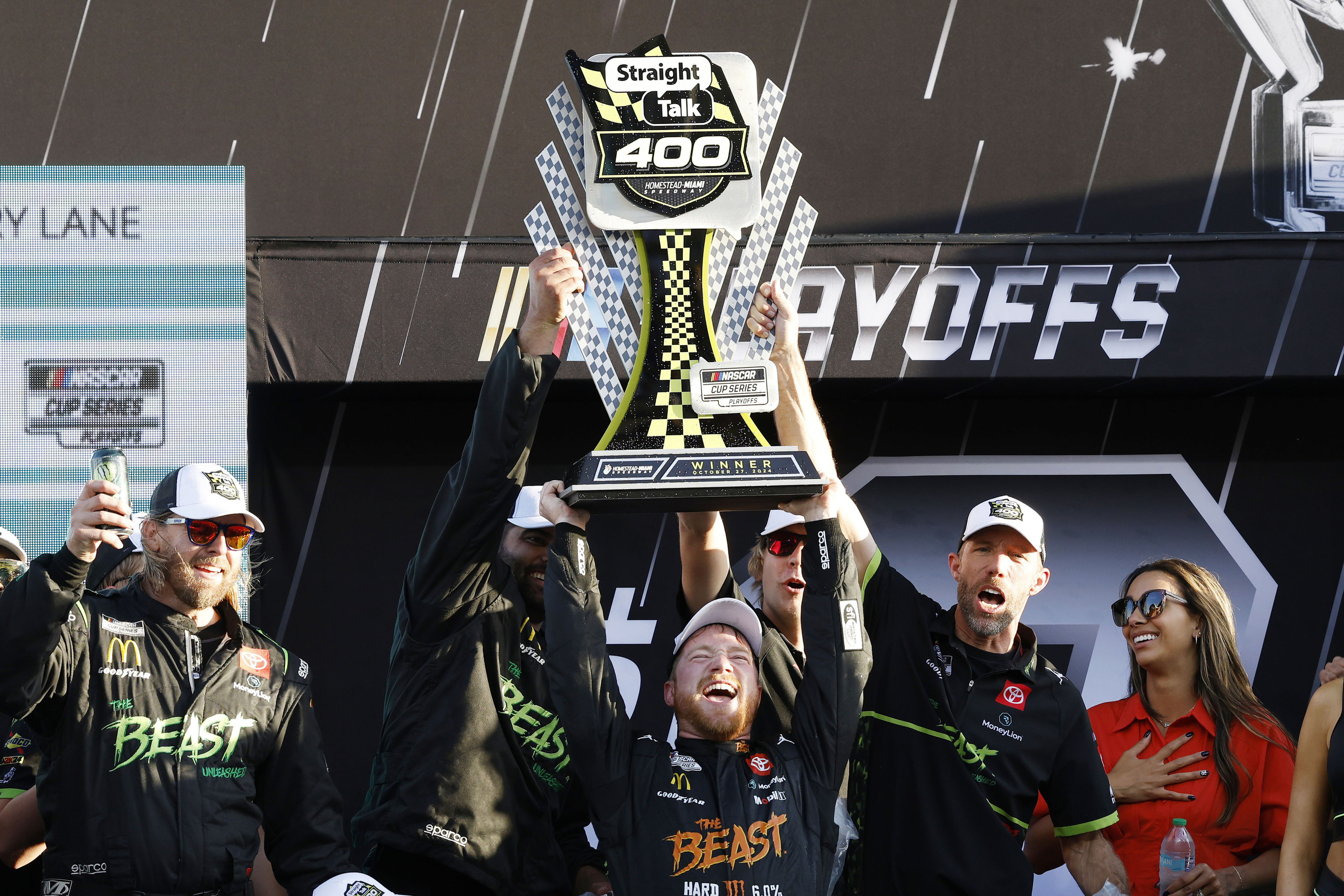 Tyler Reddick, center, celebrates in Victory Lane after winning a NASCAR Cup Series auto race