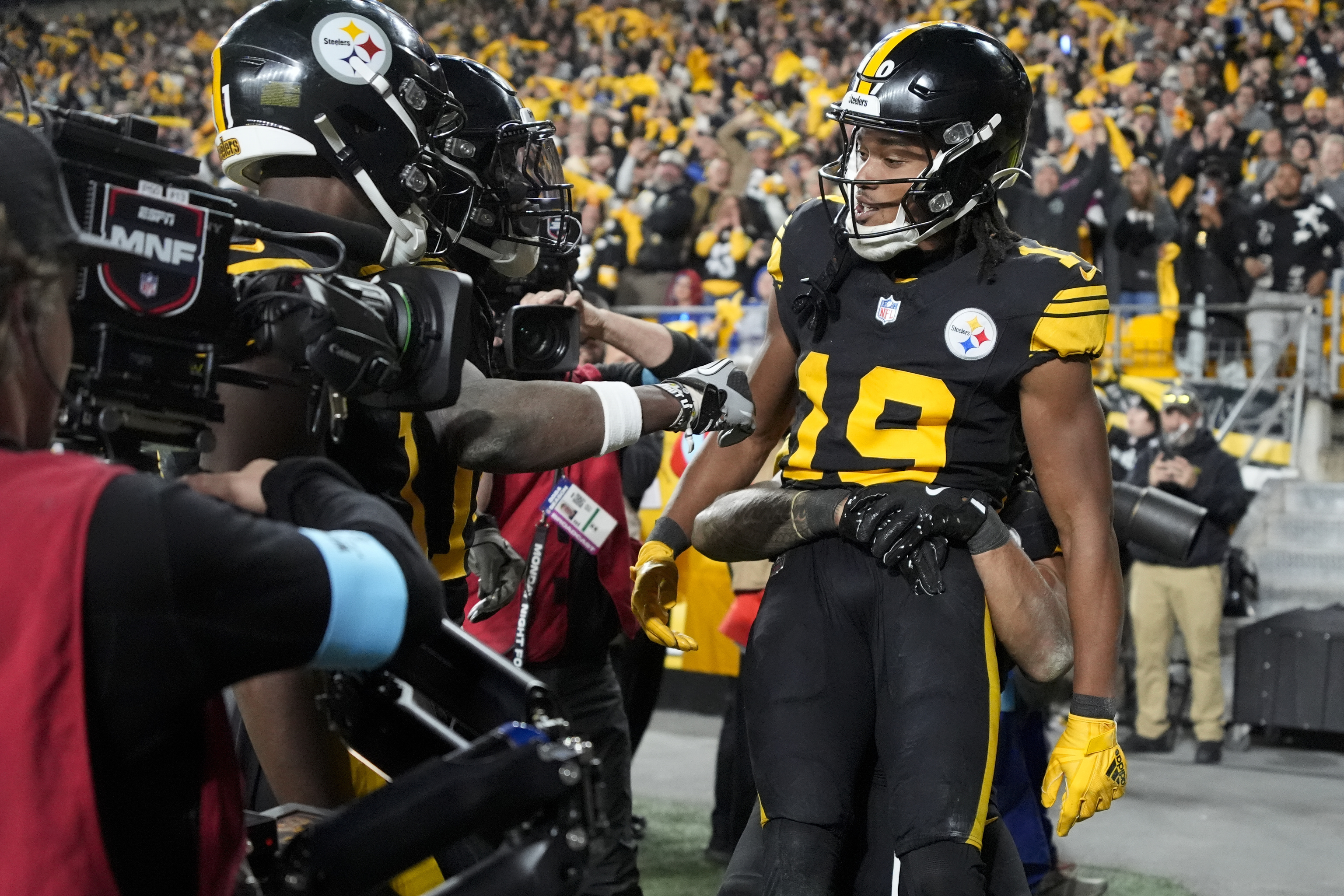 Pittsburgh Steelers wide receiver Calvin Austin III (19) celebrates his touchdown catch.