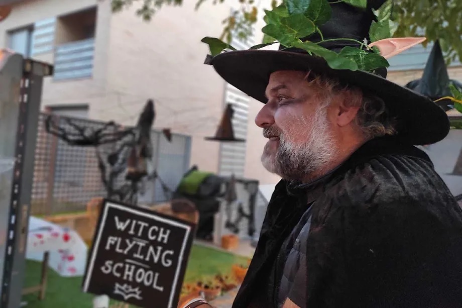 A neighbor and his witch school in the backyard.