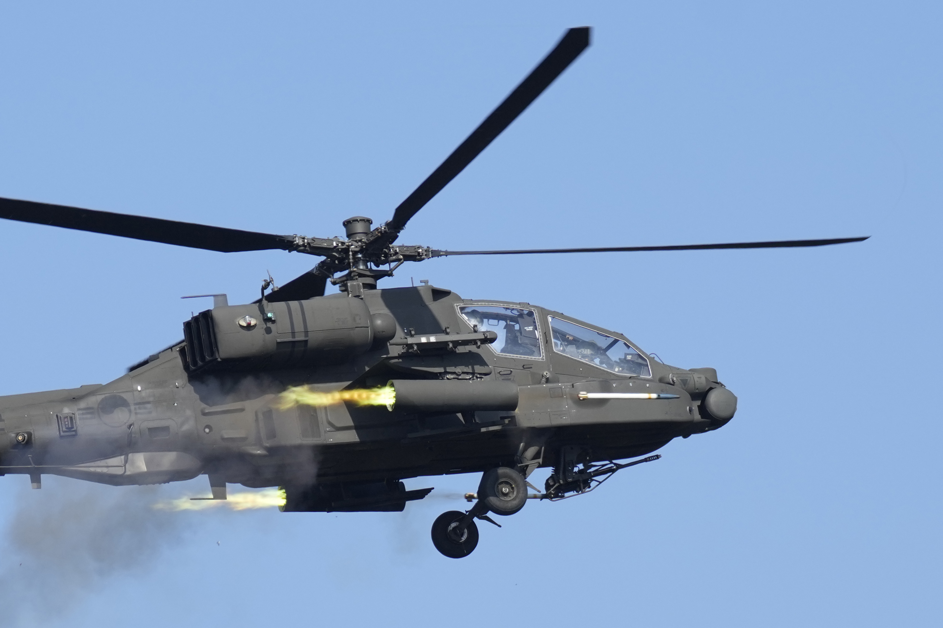 A South Korean army AH-64E Apache helicopter fires rockets