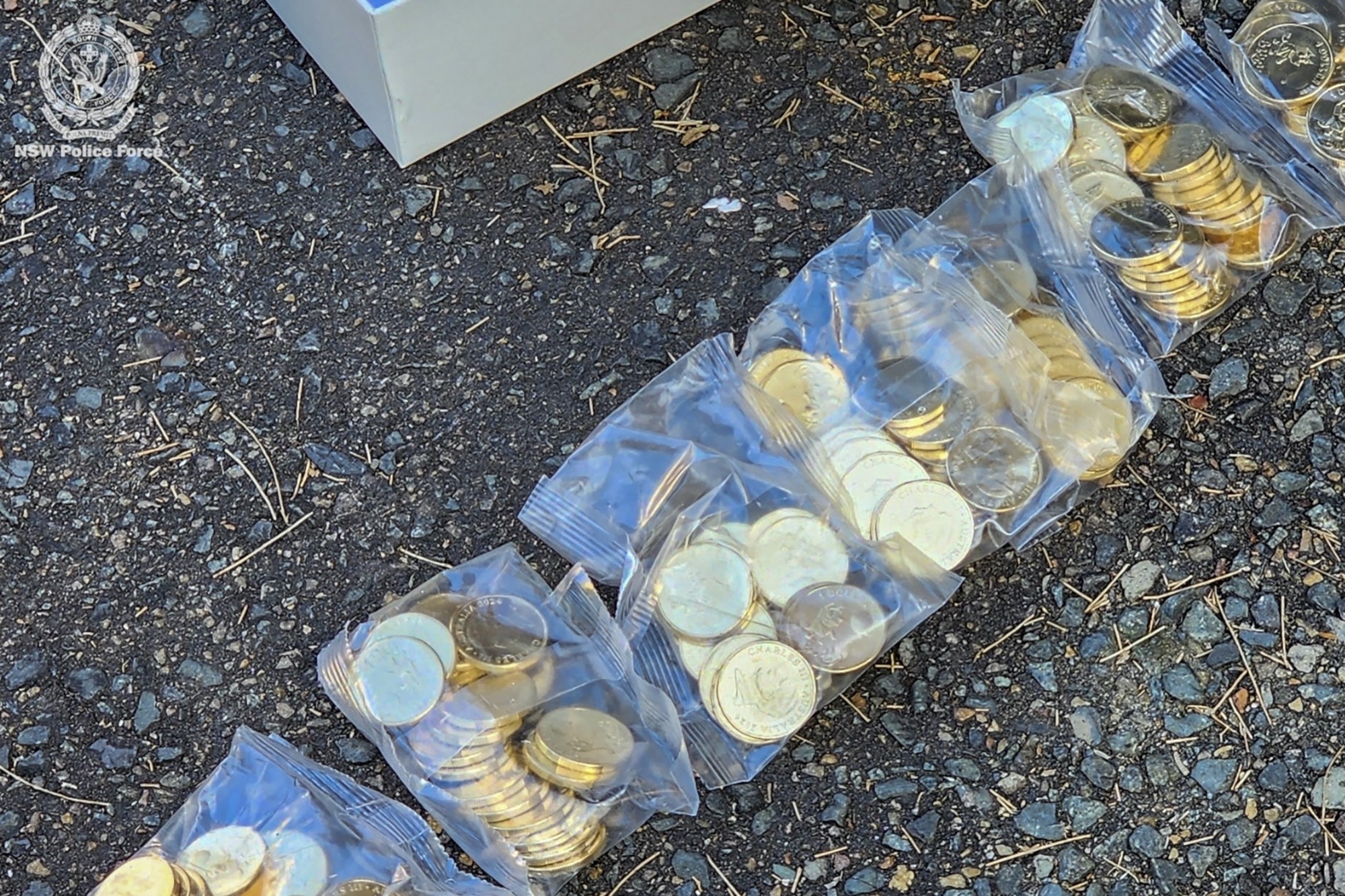 This photo released by the New South Wales Police shows some of the 40,000 stolen limited edition Bluey coins