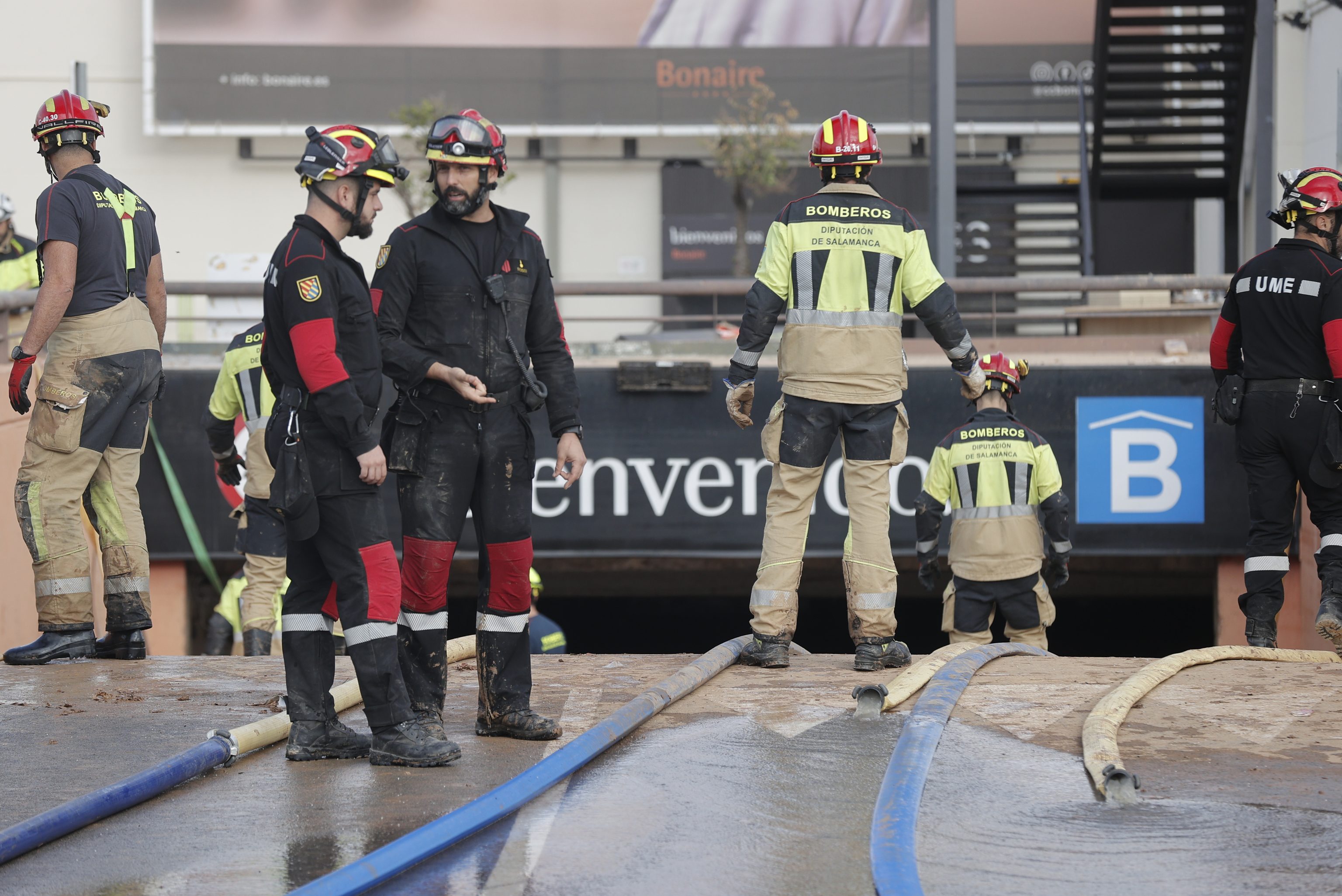 Fire department personnel extract water from the subway parking lot of the Bonaire Shopping Center.