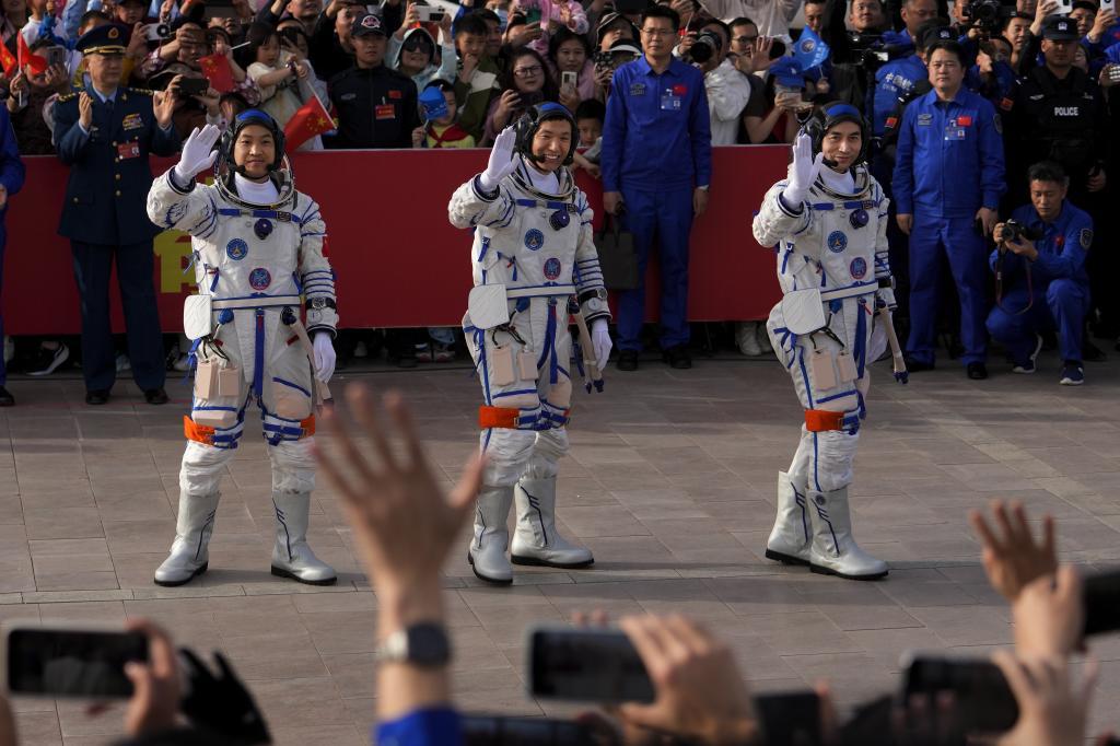 Chinese astronauts for the Shenzhou-18 mission, from right, Ye Guangfu, Li Cong, and Li Guangsu