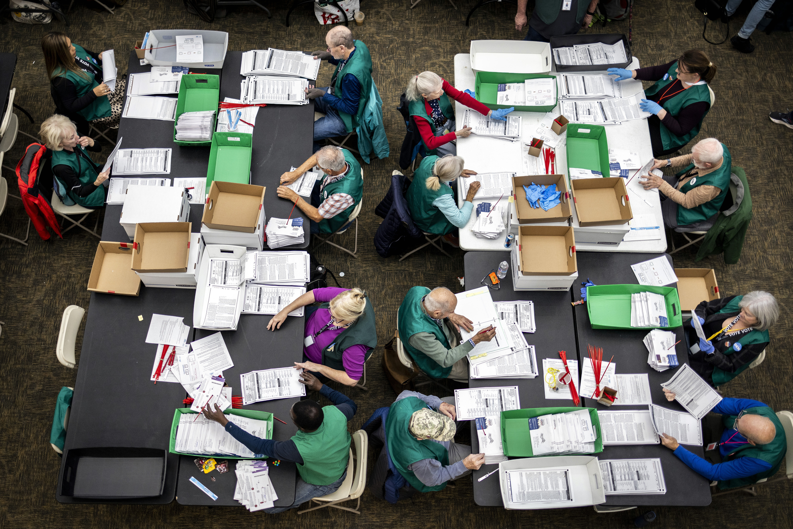 Election workers review ballots at the Denver Elections.