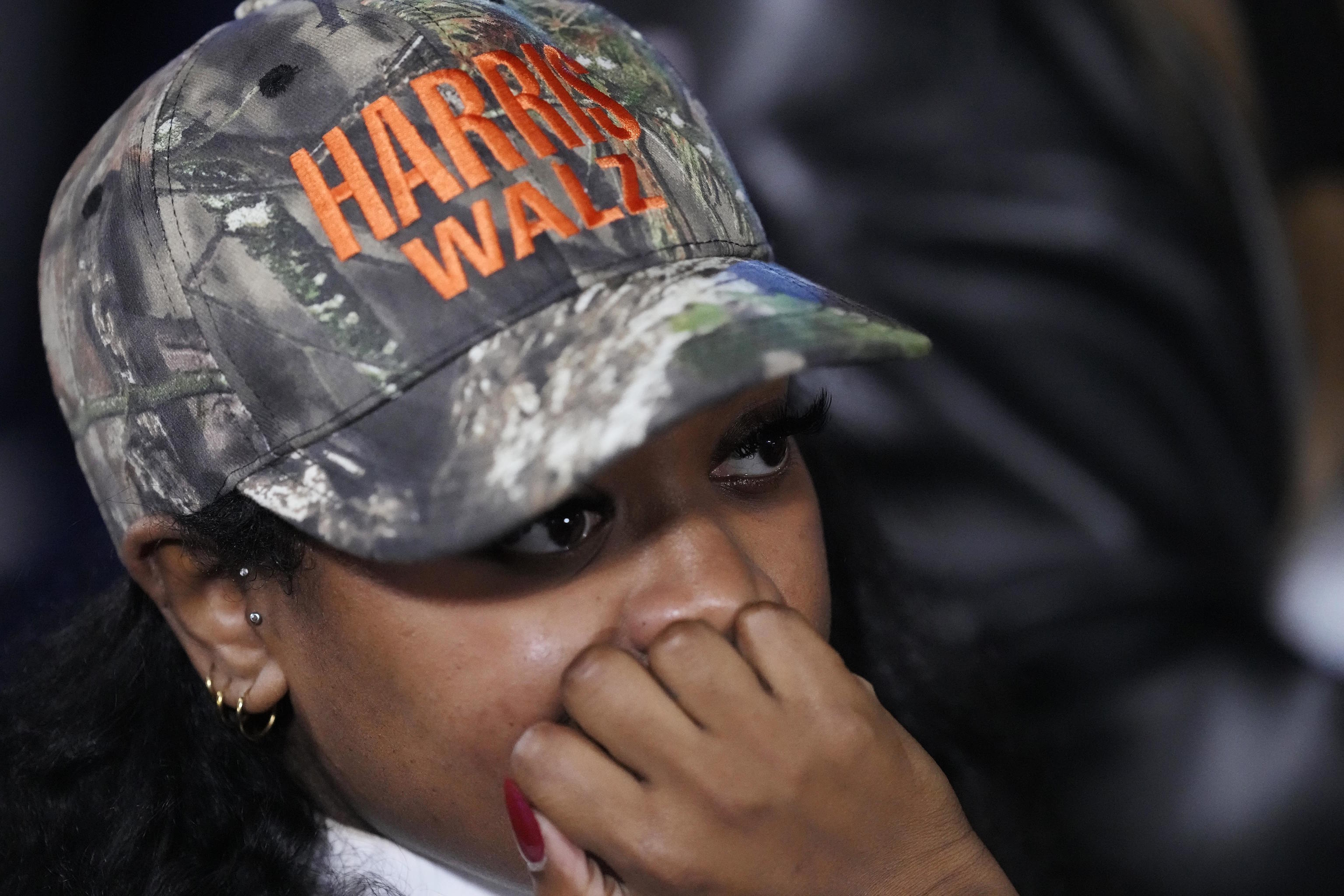 A supporter waiting during an election night campaign watch party.