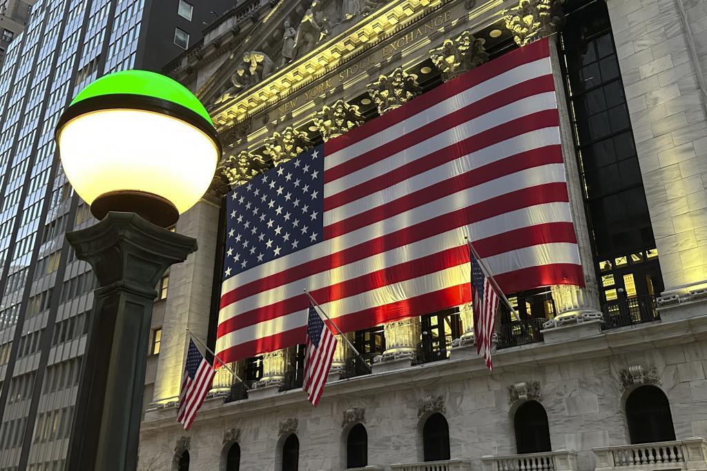 The American flags hangs on the facade of the New York Stock Exchange in New York's Financial District