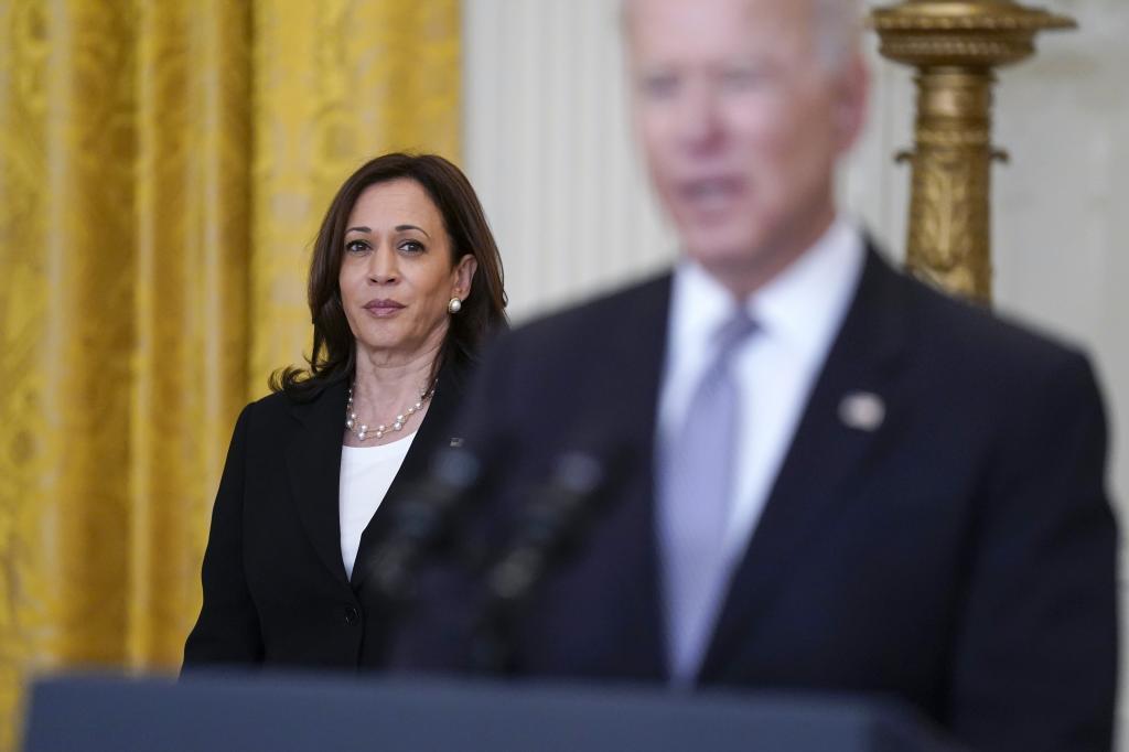 Vice President Kamala Harris listens to President Joe Biden.