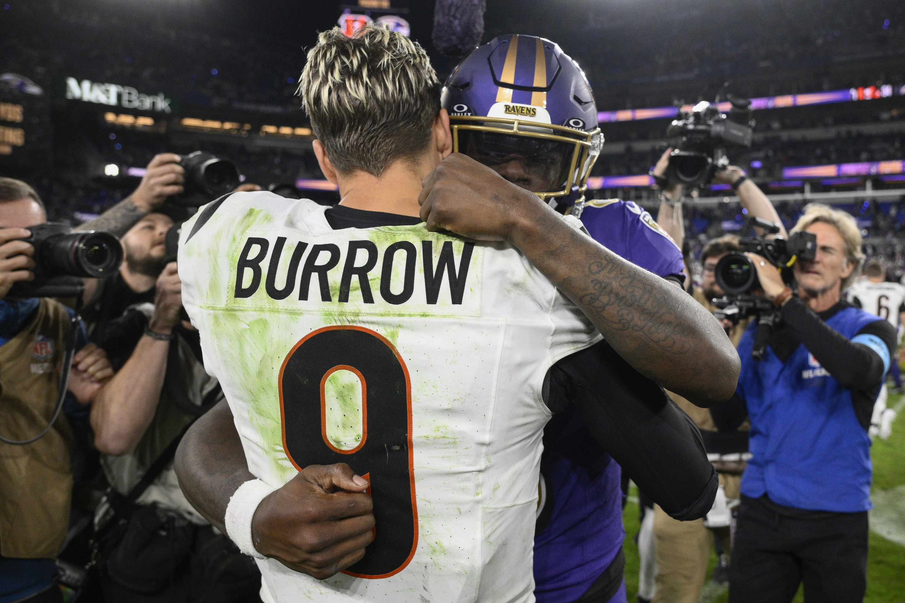 Cincinnati Bengals quarterback Joe Burrow (9) and Baltimore Ravens quarterback Lamar Jackson (8).