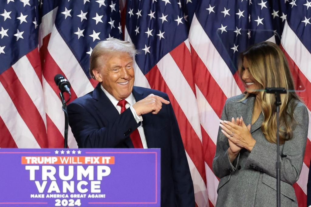 Trump speaks at an election night event alongside his wife.