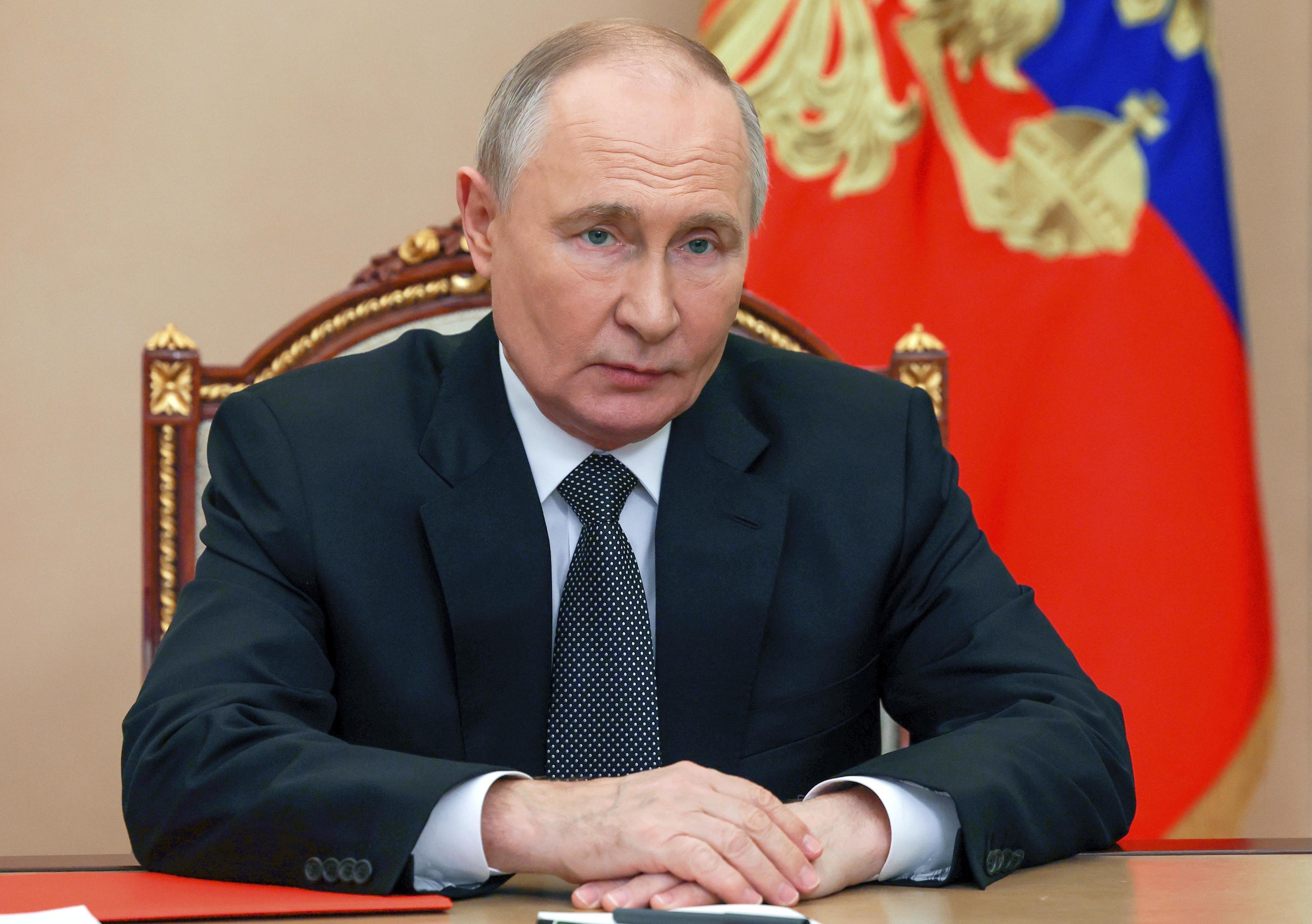 Putin chairs a Security Council meeting via videoconference at the Kremlin.
