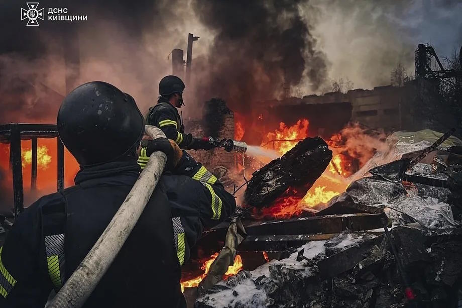 Rescue teams extinguished a fire in a building destroyed by a Russian attack in Brovary, on the outskirts of Kiev.