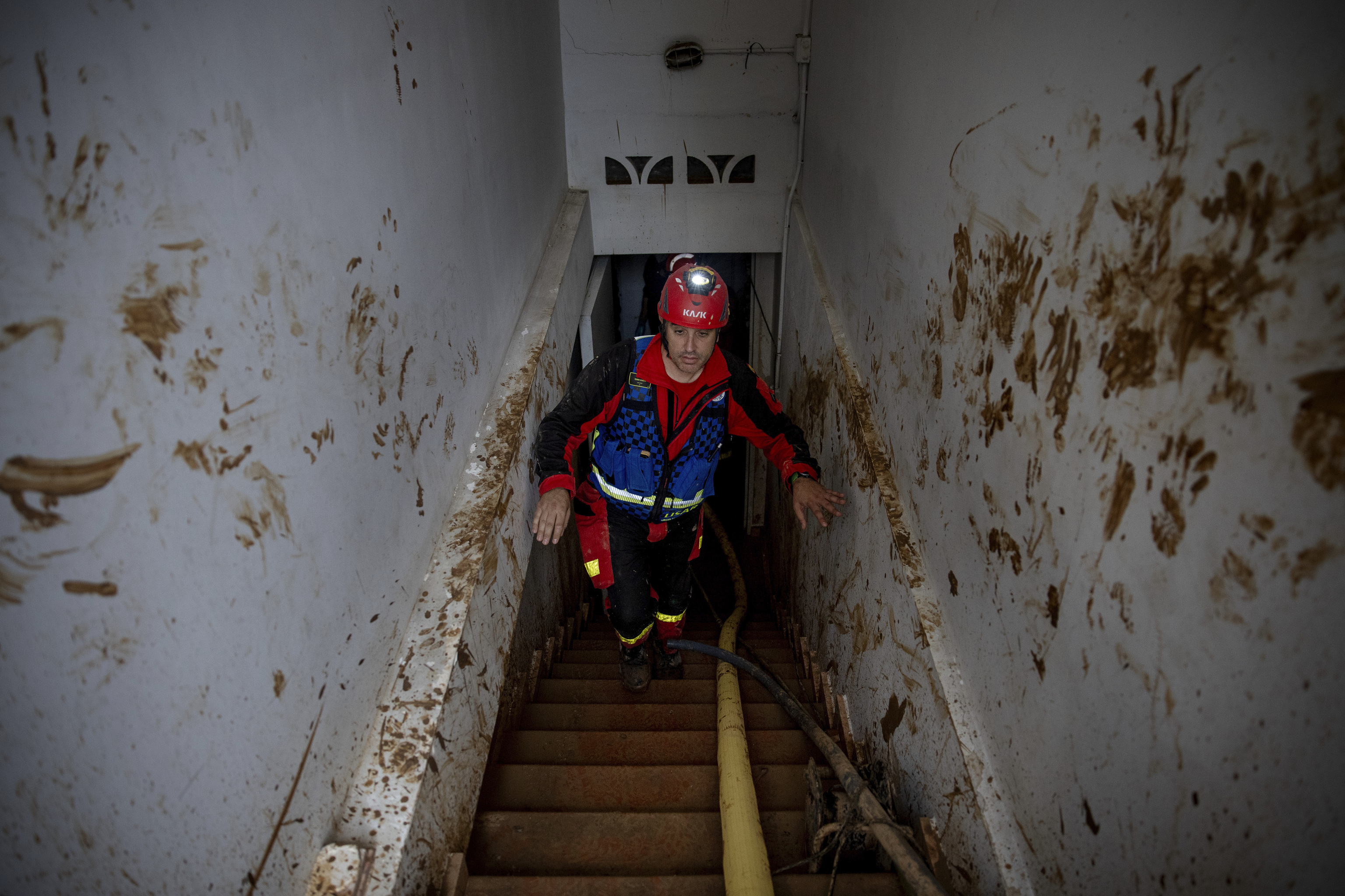 A member of the fire department works in the search for missing persons.