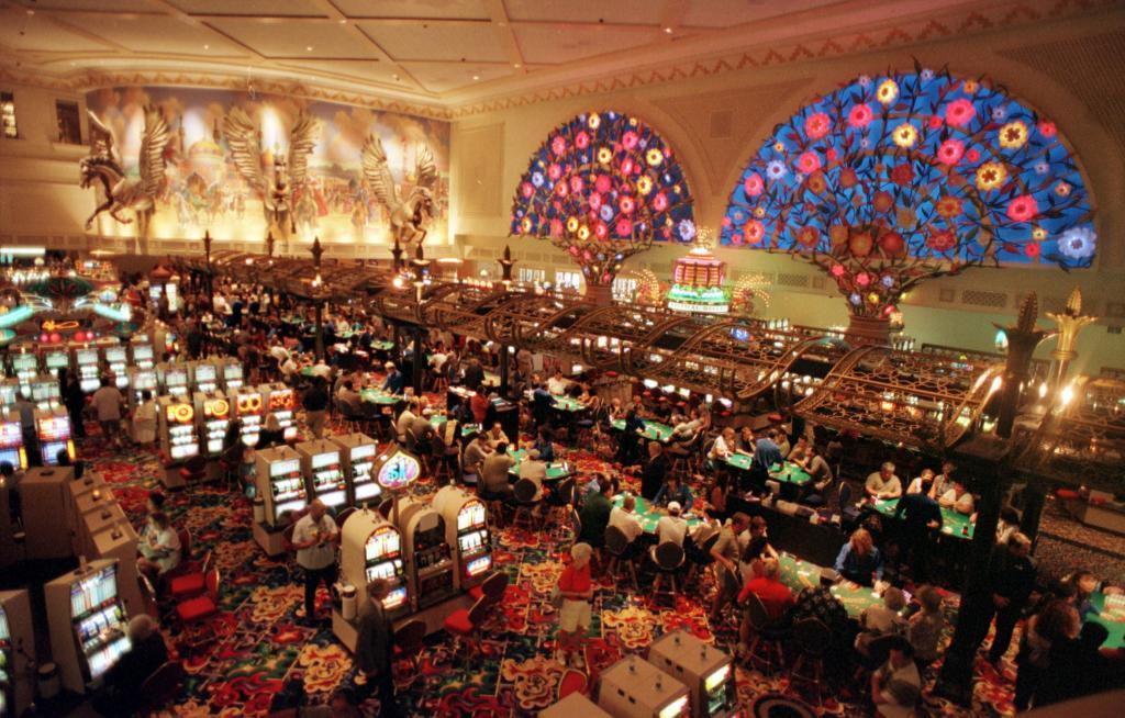 Customers playing slot machines in a Las Vegas casino