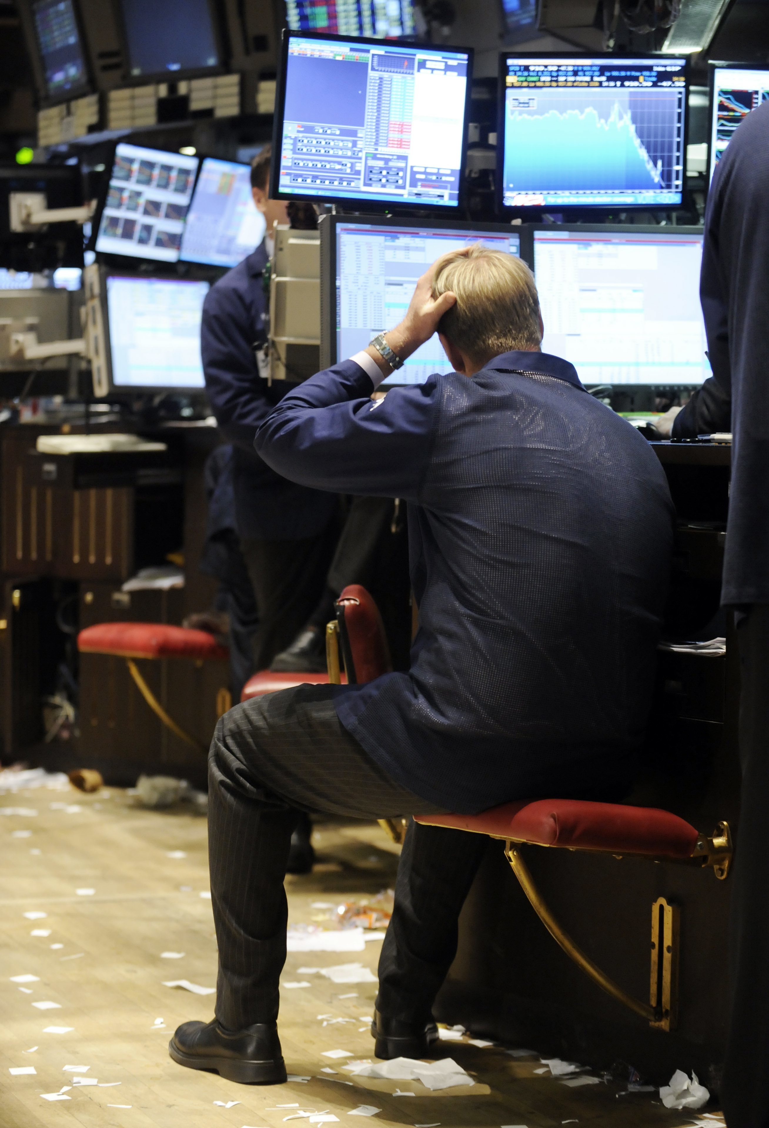 A specialist works at his post on the floor of the New York Stock Exchange.