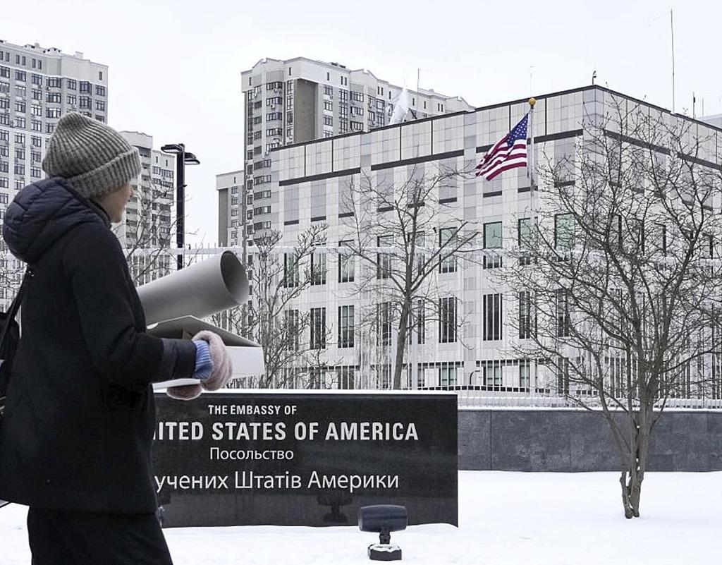 A woman walks past the U.S. Embassy in Kyiv, Ukraine