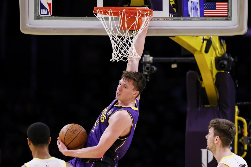 Los Angeles Lakers guard Dalton Knecht dunks during the first half of an Emirates NBA Cup basketball game agaianst the Utah Jazz