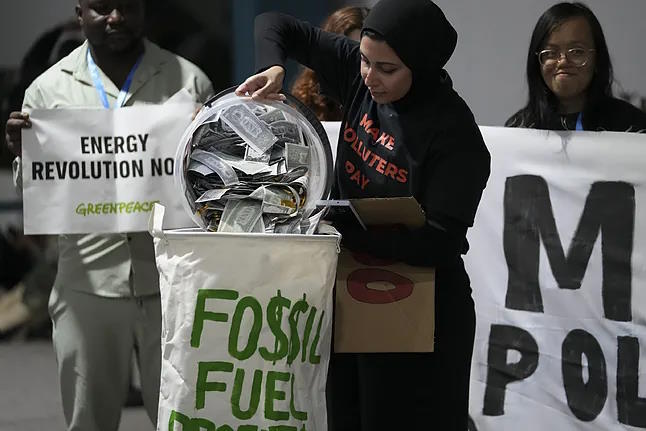 Activists participate in a protest against fossil fuels during COP29 in Baku.