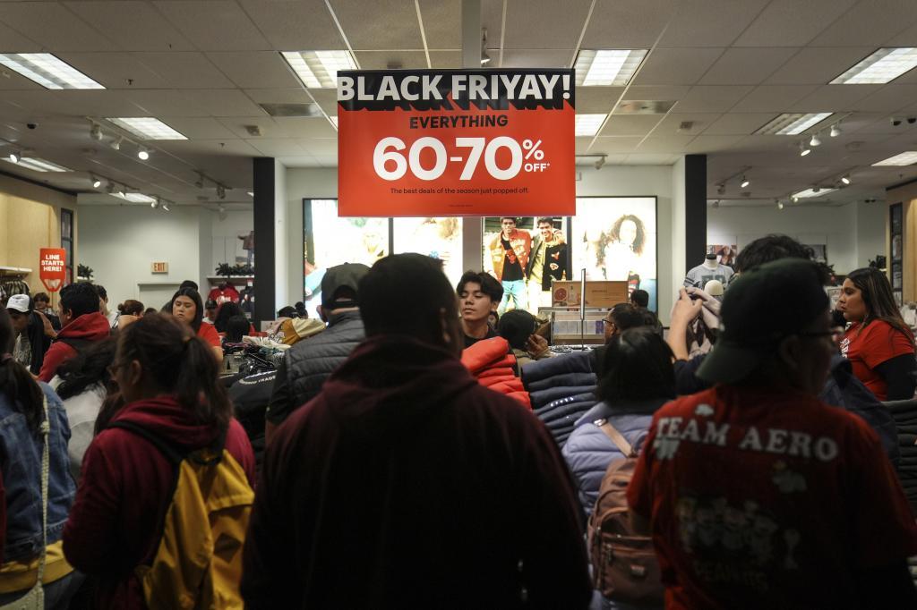 Early Black Friday shoppers browse a store at Citadel Outlets in Commerce