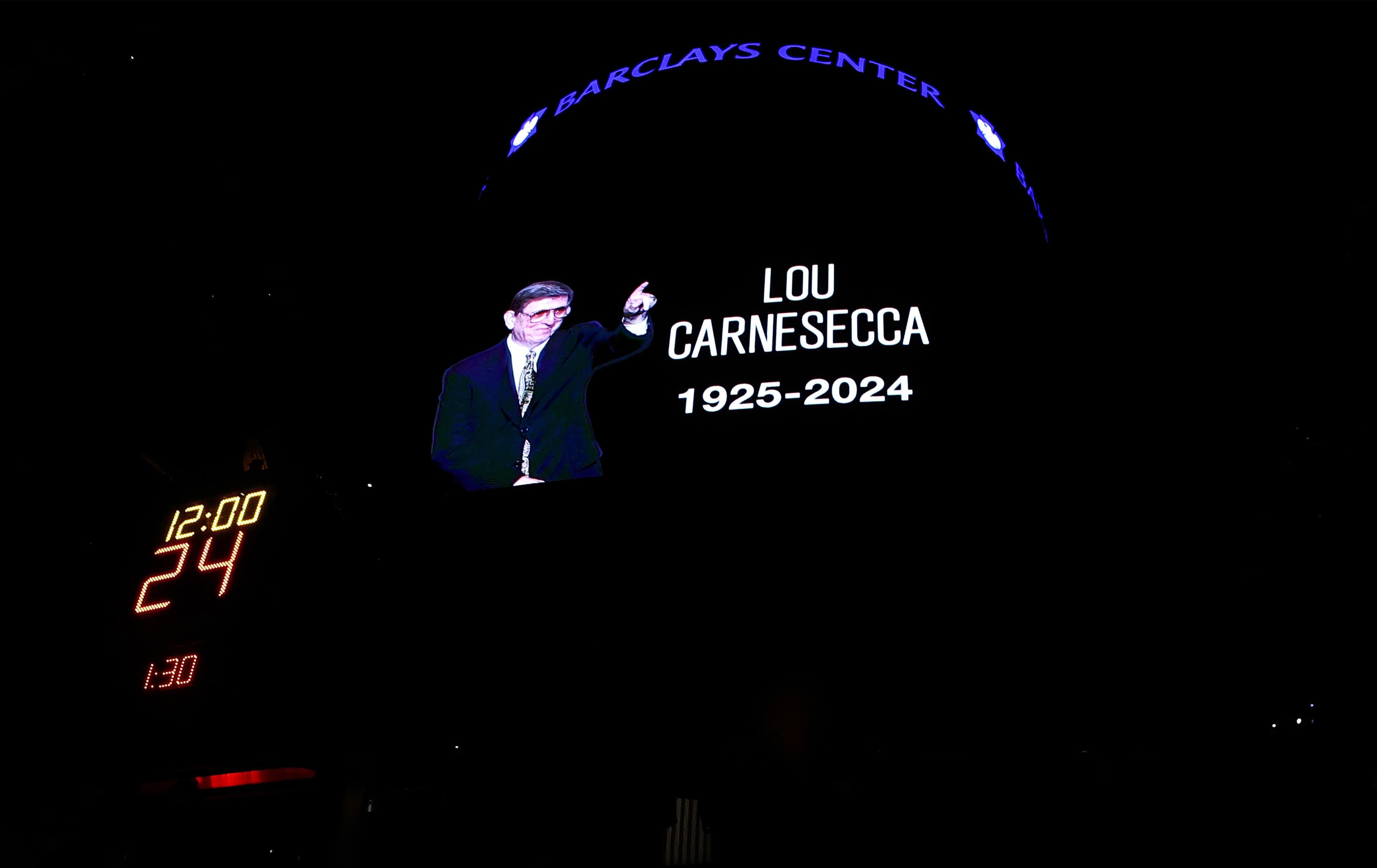 Silence in memory of former St. John's coach Lou Carnesecca.