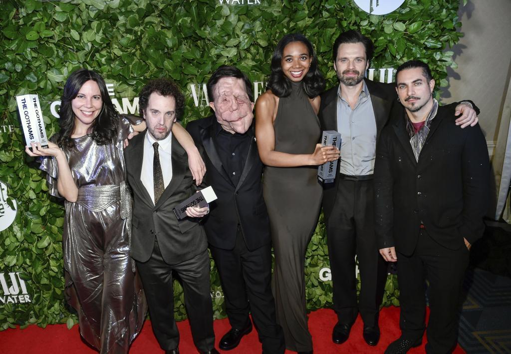 From left, Vanessa McDonnell, Aaron Schimberg, Adam Pearson, Gabriel Mayers, Sebastian Stan and Mike Marino pose with the best feature award for "A Different Man" during The Gothams Film Awards