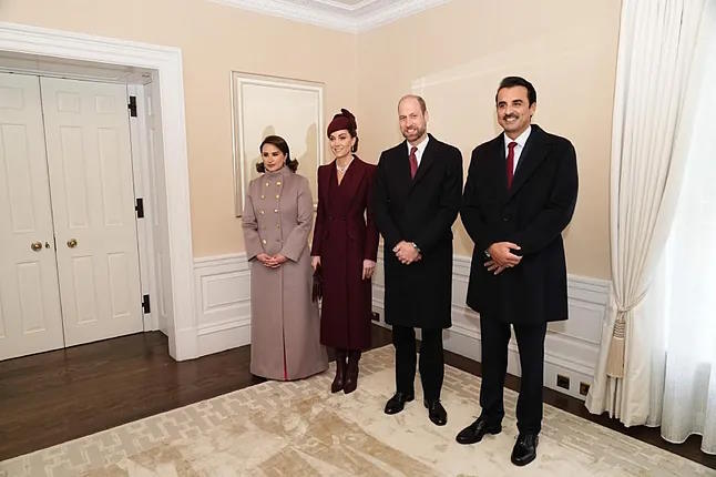 The Emir of Qatar and his wife, welcomed by the Prince of Wales.