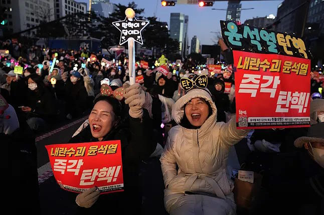 Protesters during a march demanding the removal of President in Seoul.