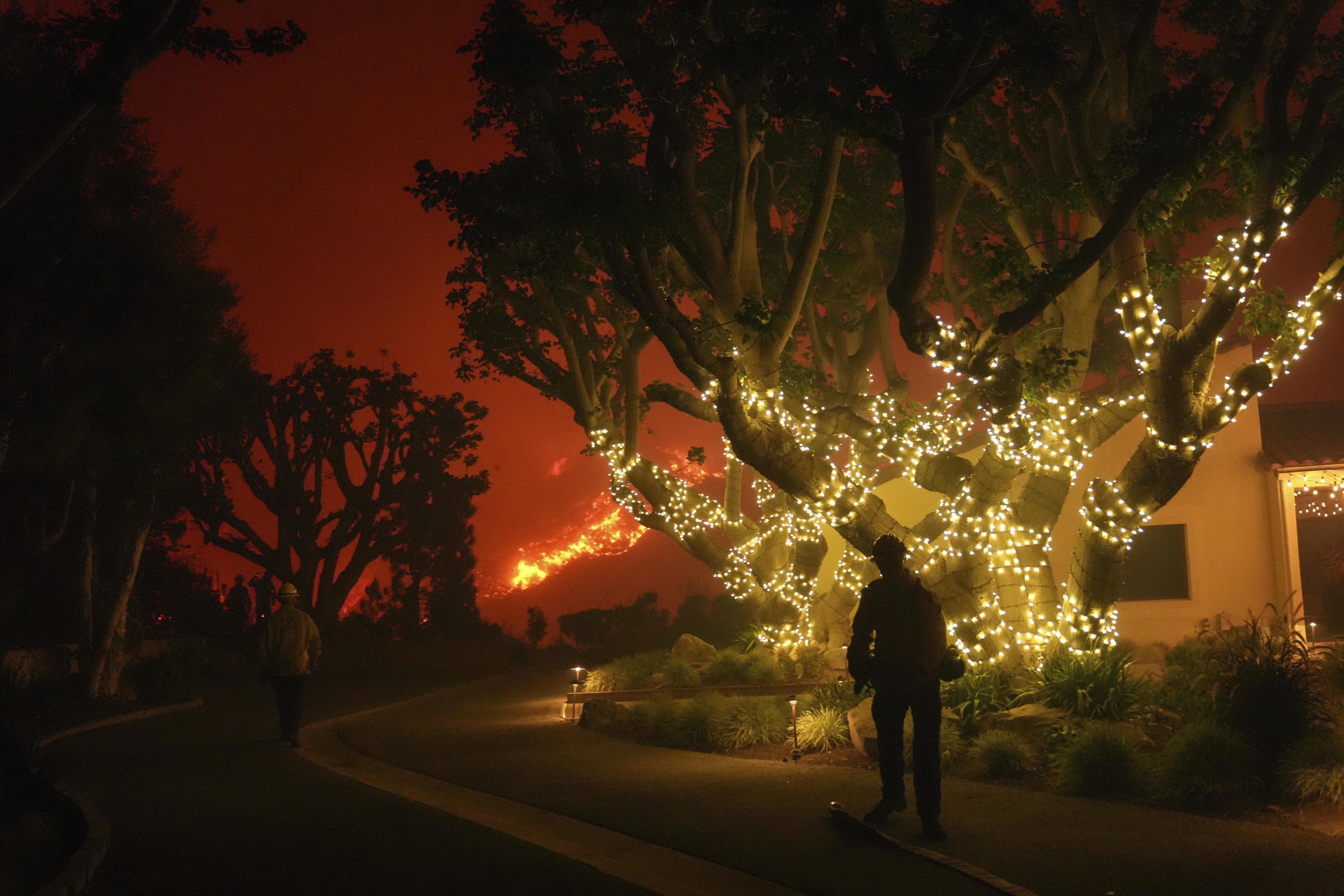 Firefighters monitor the Franklin Fire near Pepperdine University in Malibu.