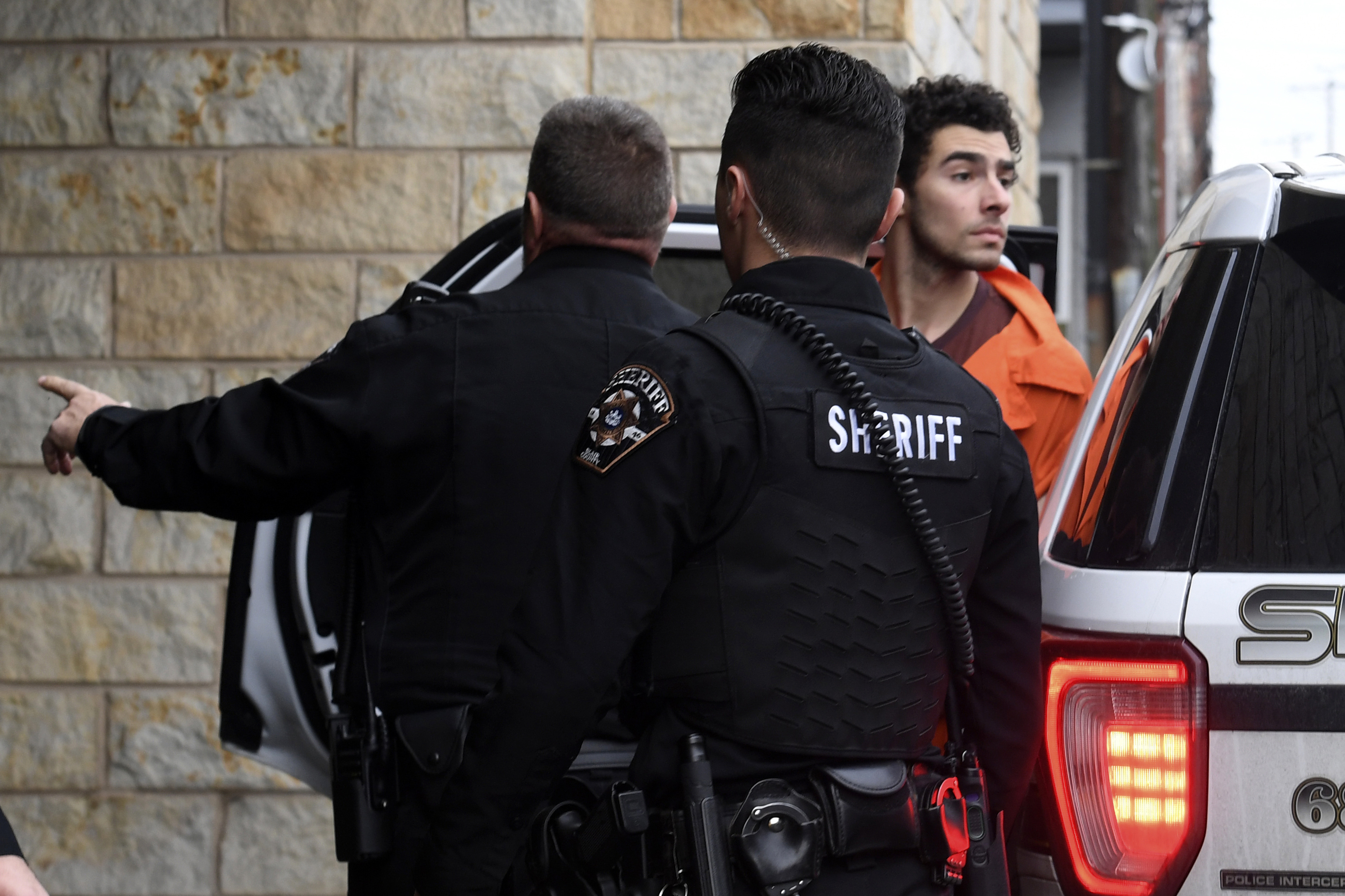 Luigi Nicholas Mangione is escorted into Blair County Courthouse.