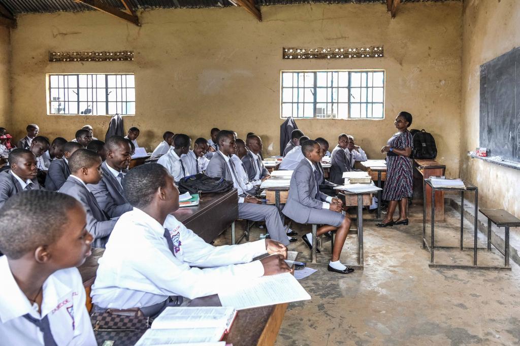 A teacher gives a lesson to his students at Wampewo Ntakke Secondary School in Kawempe tula village, Kampala, Uganda