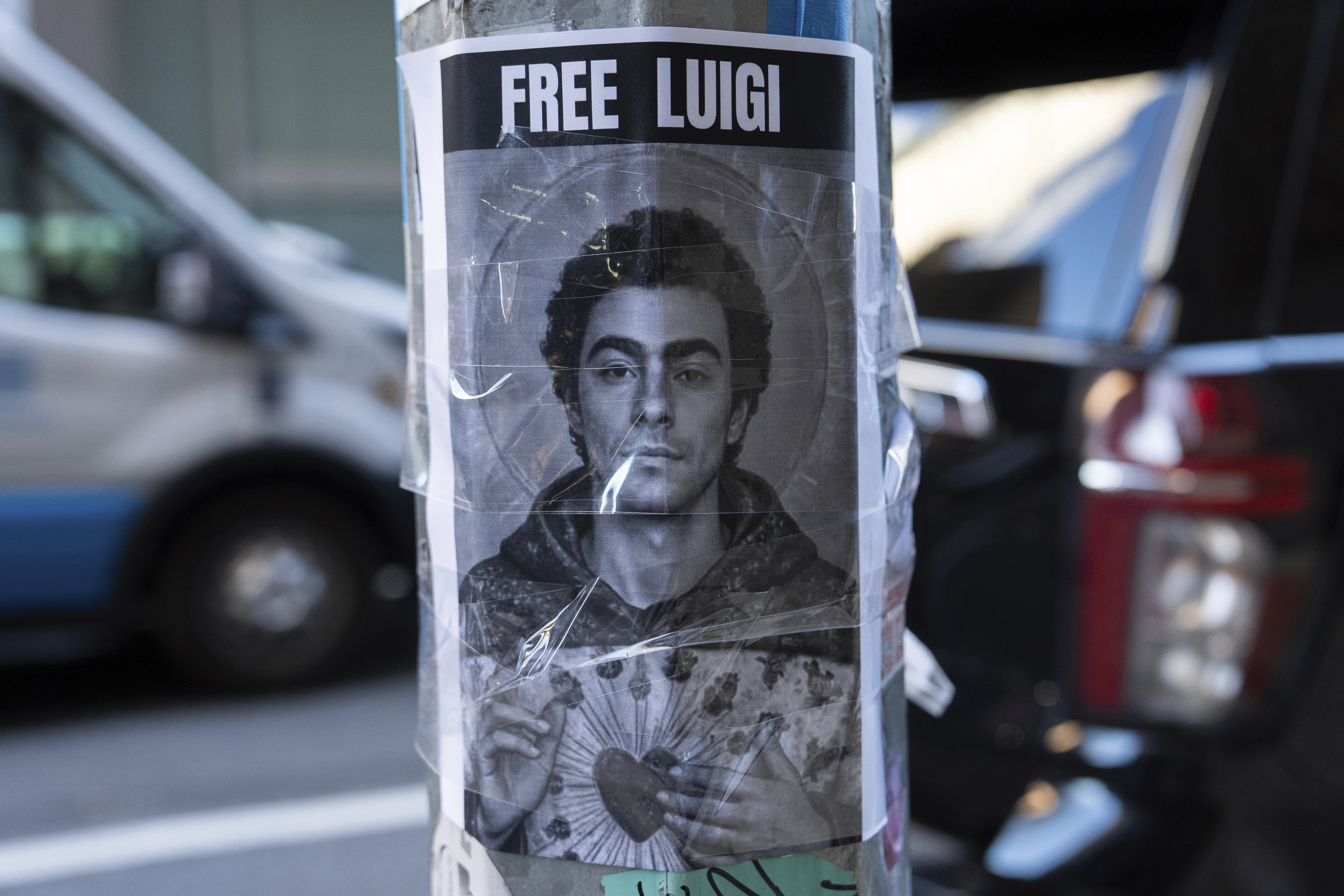 A poster depicting Luigi Mangione hangs outside the New York Hilton Midtown hotel, in New York.