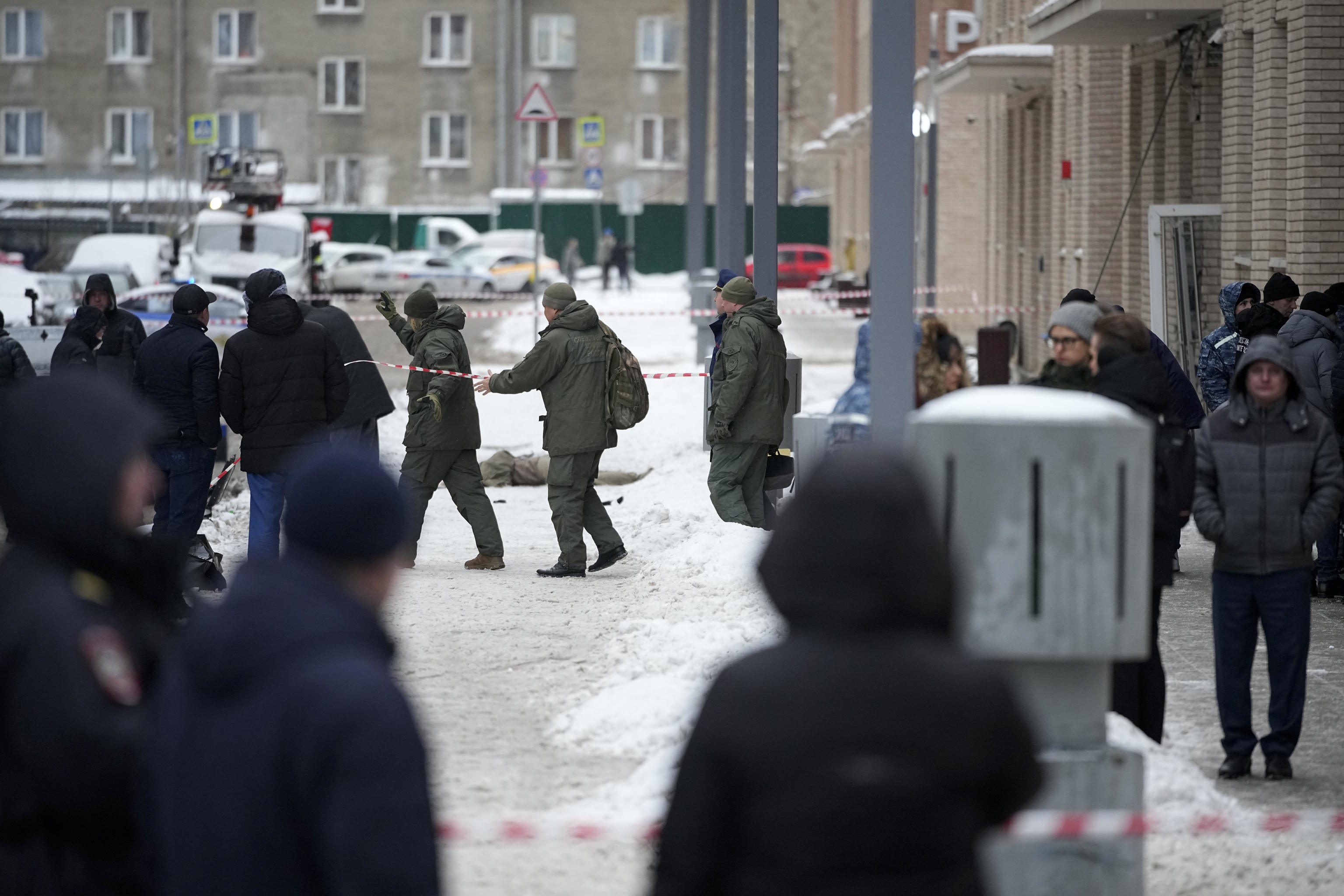 Investigators work at the place where Lt. General Igor Kirillov was killed.